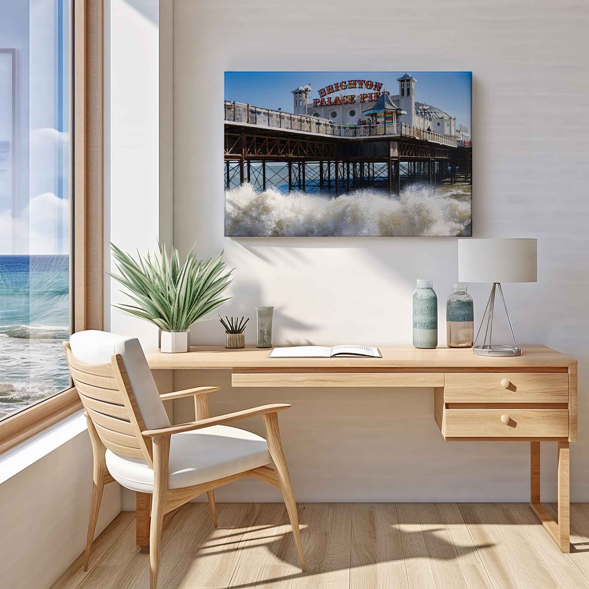 Brighton Palace Pier canvas wall art displayed above a light wood desk in a modern home office featuring the iconic Victorian pier and crashing waves.