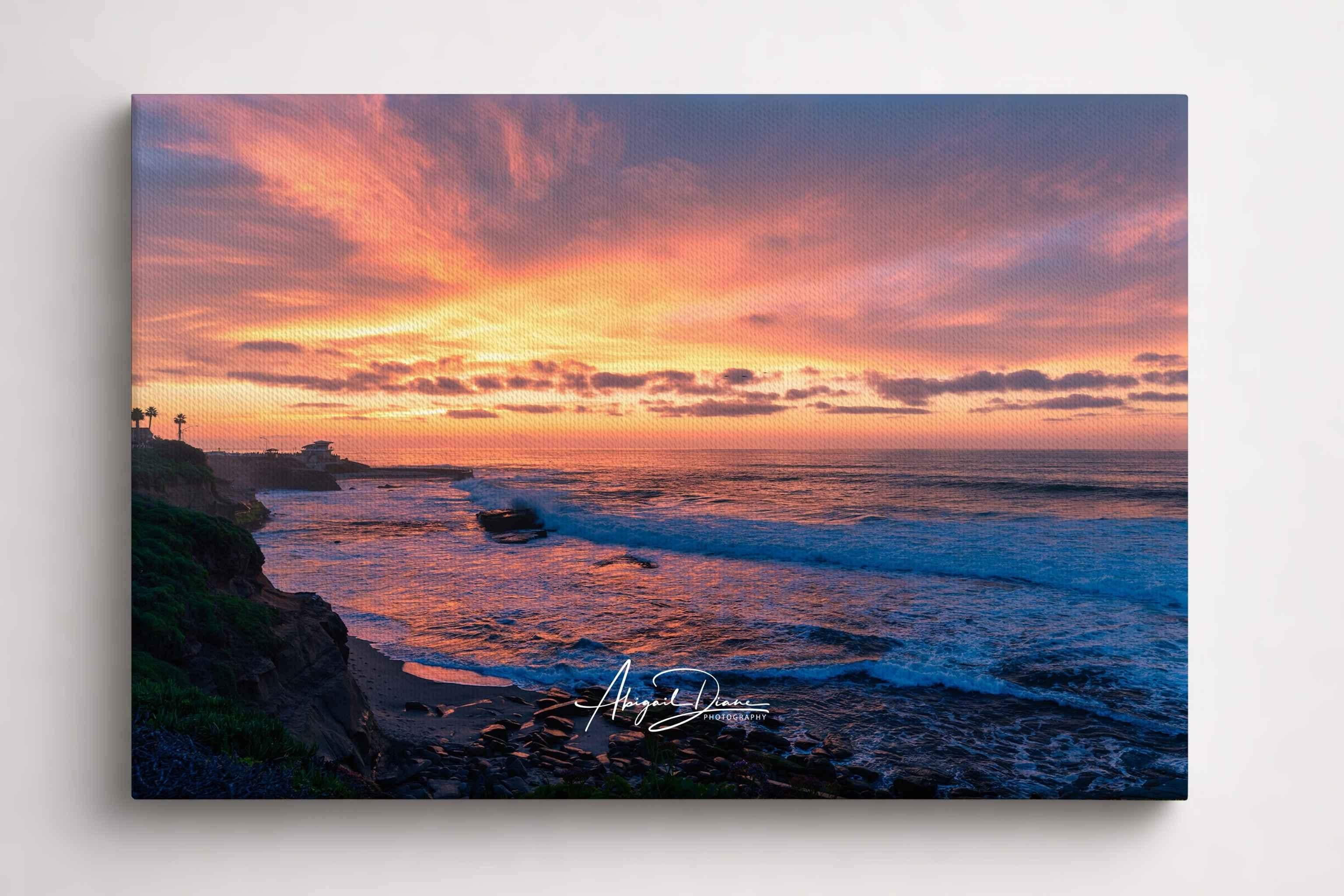 Candy Floss Sunset captures soft pink, peach, and lavender skies above the Pacific Ocean at Laguna Beach, California. Fine art coastal wall art by Abigail Diane Photography.