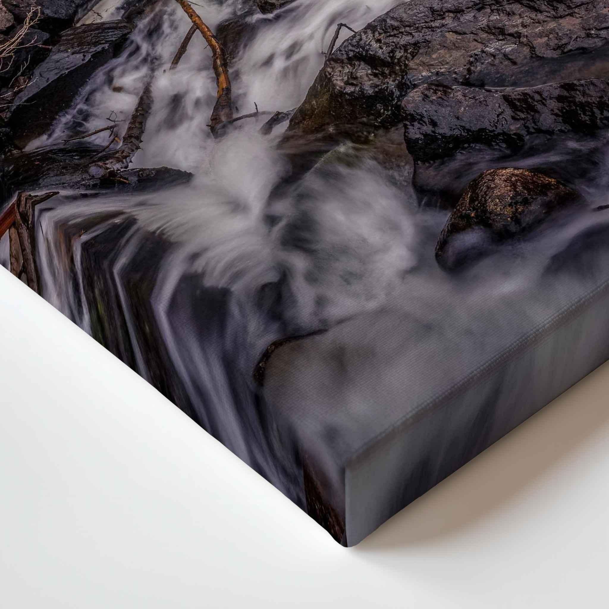 Close-up corner detail of Cascading Into Stillness canvas print, showing flowing water cascading over rocks in Mammoth Lakes, California.