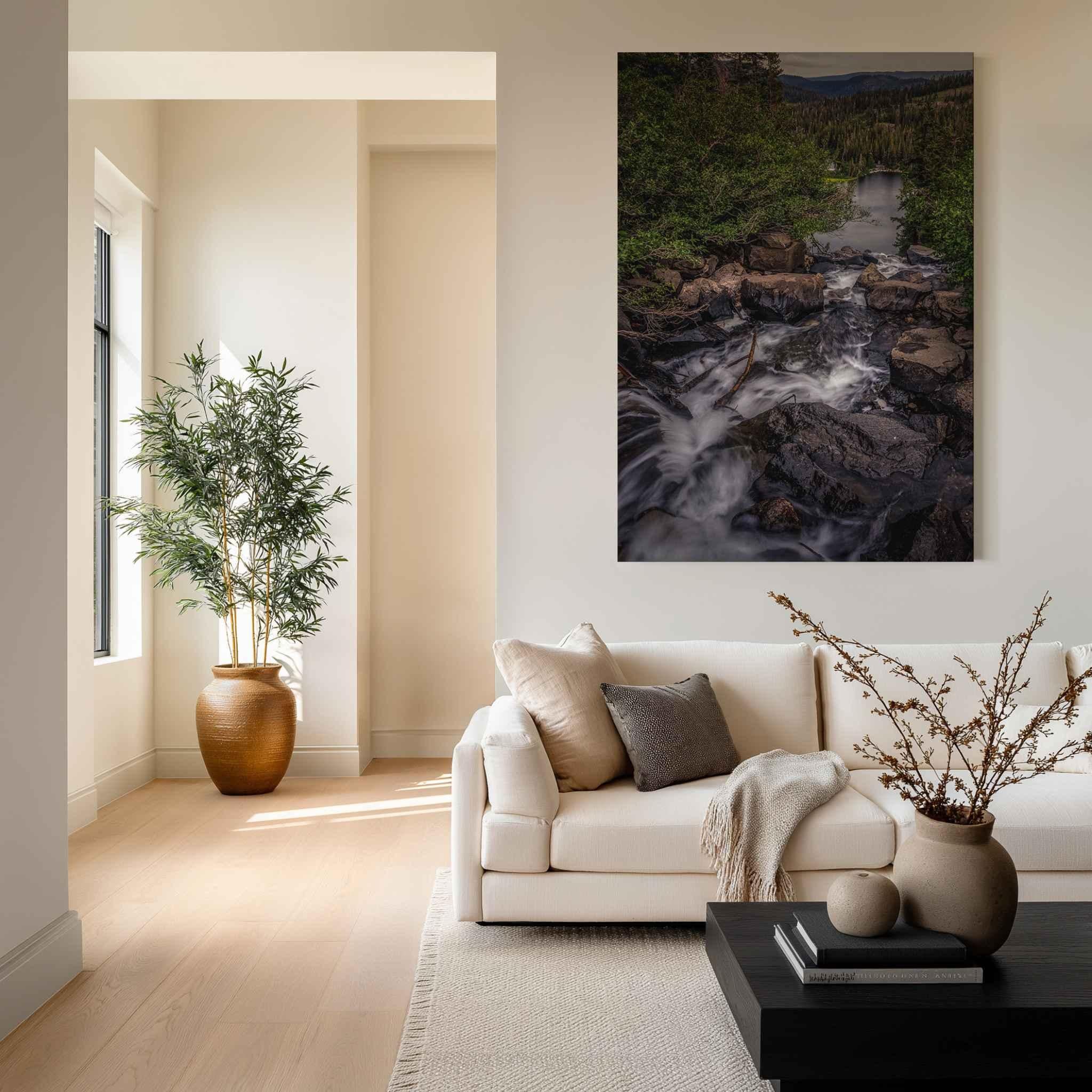 Cascading Into Stillness HD metal print featuring Twin Falls in Mammoth Lakes, California, displayed above a white sofa in a bright modern living room.