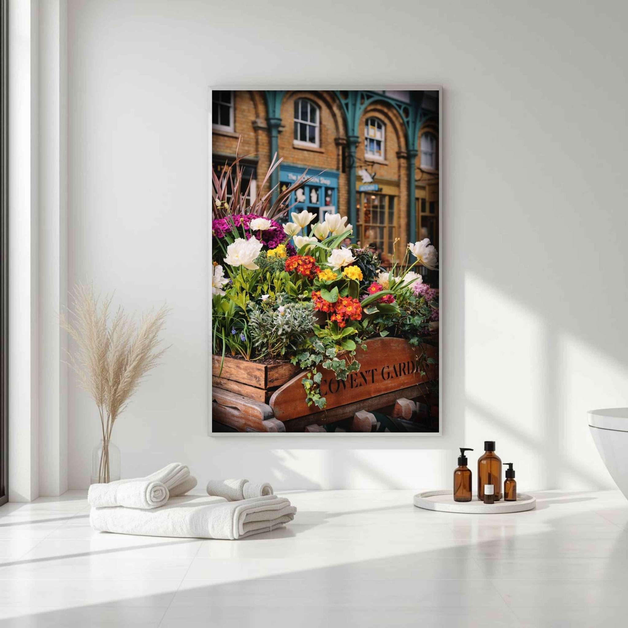 Covent Garden in Bloom floral wall art by Abigail Diane Photography displayed in a bright spa-inspired bathroom with white walls, natural light, and botanical decor.