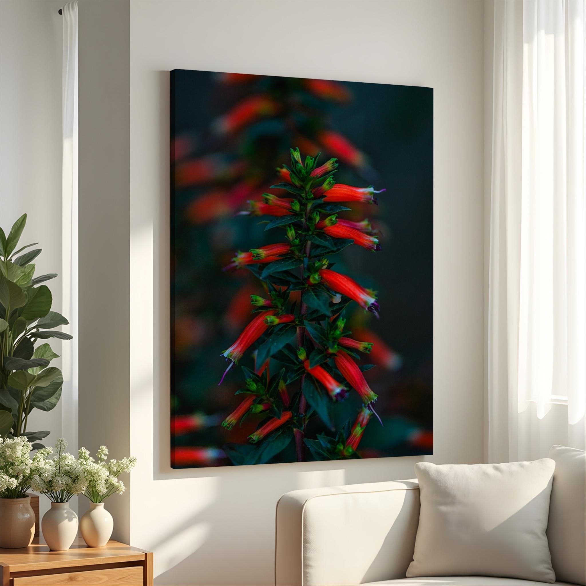 Gallery wrapped canvas featuring Crimson Whispers at Twilight, a dramatic firecracker plant botanical photograph displayed in a bright modern living room with a white sofa, wooden side table, white ceramic vases, and natural light