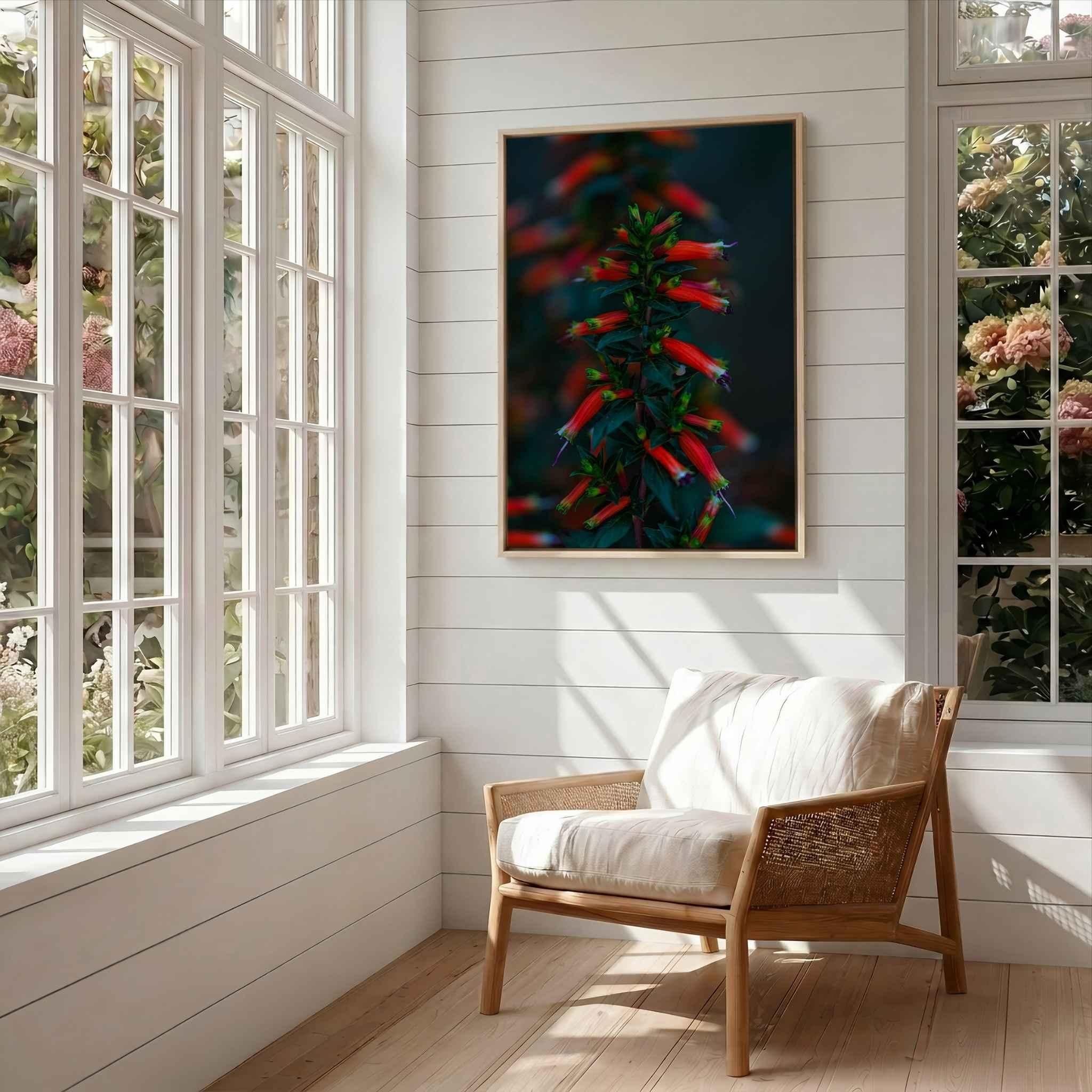 Crimson Whispers at Twilight framed botanical print displayed above a modern reading chair in a sunlit reading nook with large windows and natural wood accents.