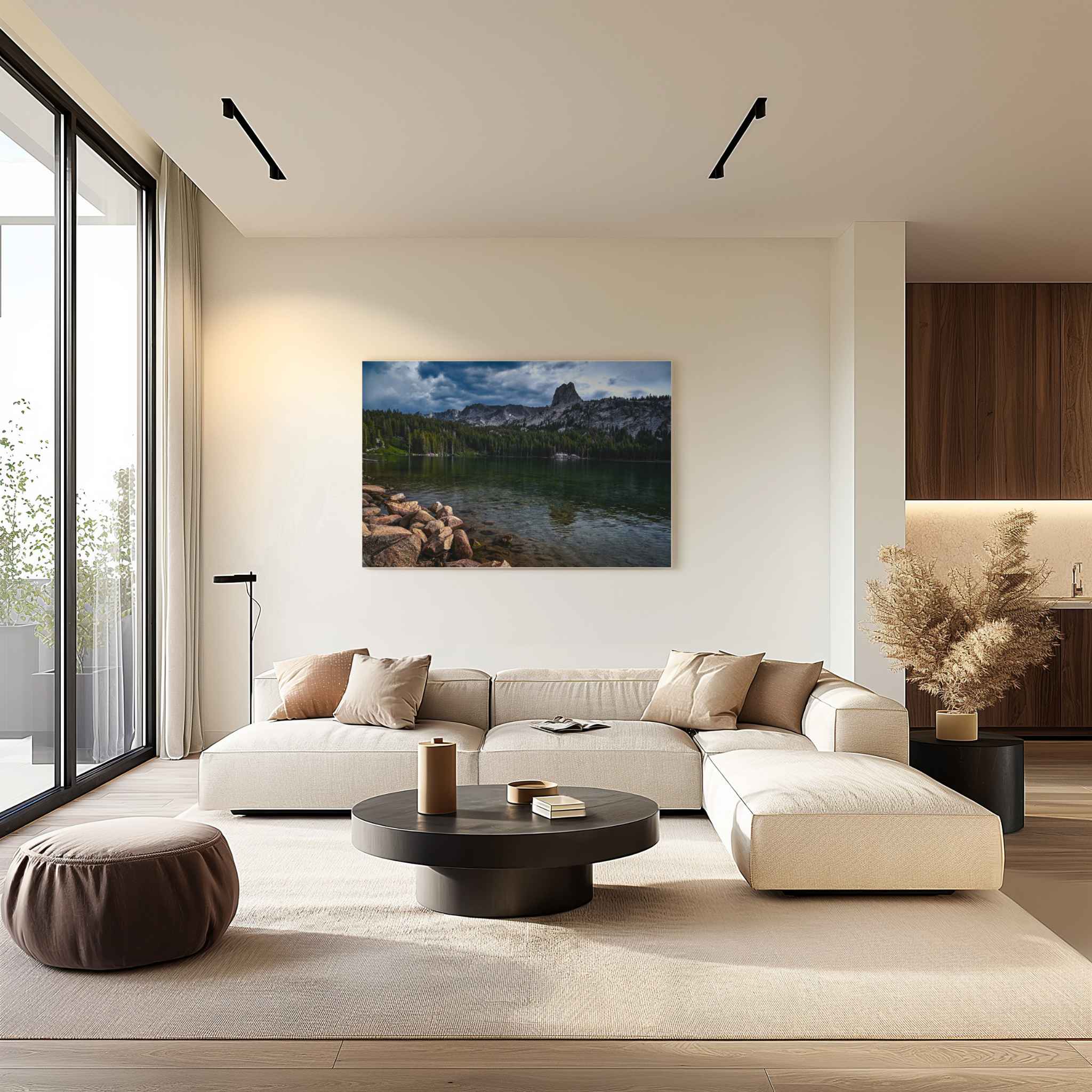 Eastern Sierra mountain lake landscape displayed as wall art above a neutral sectional sofa in a warm contemporary living room.