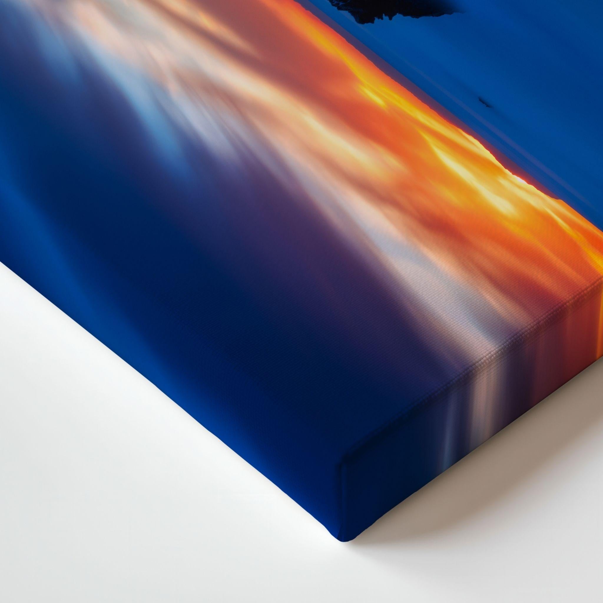 Close-up of Escape to a Magical Blue Hour gallery-wrapped canvas corner featuring a vibrant blue hour sunset with glowing orange clouds and wrapped canvas edges by Abigail Diane Photography.