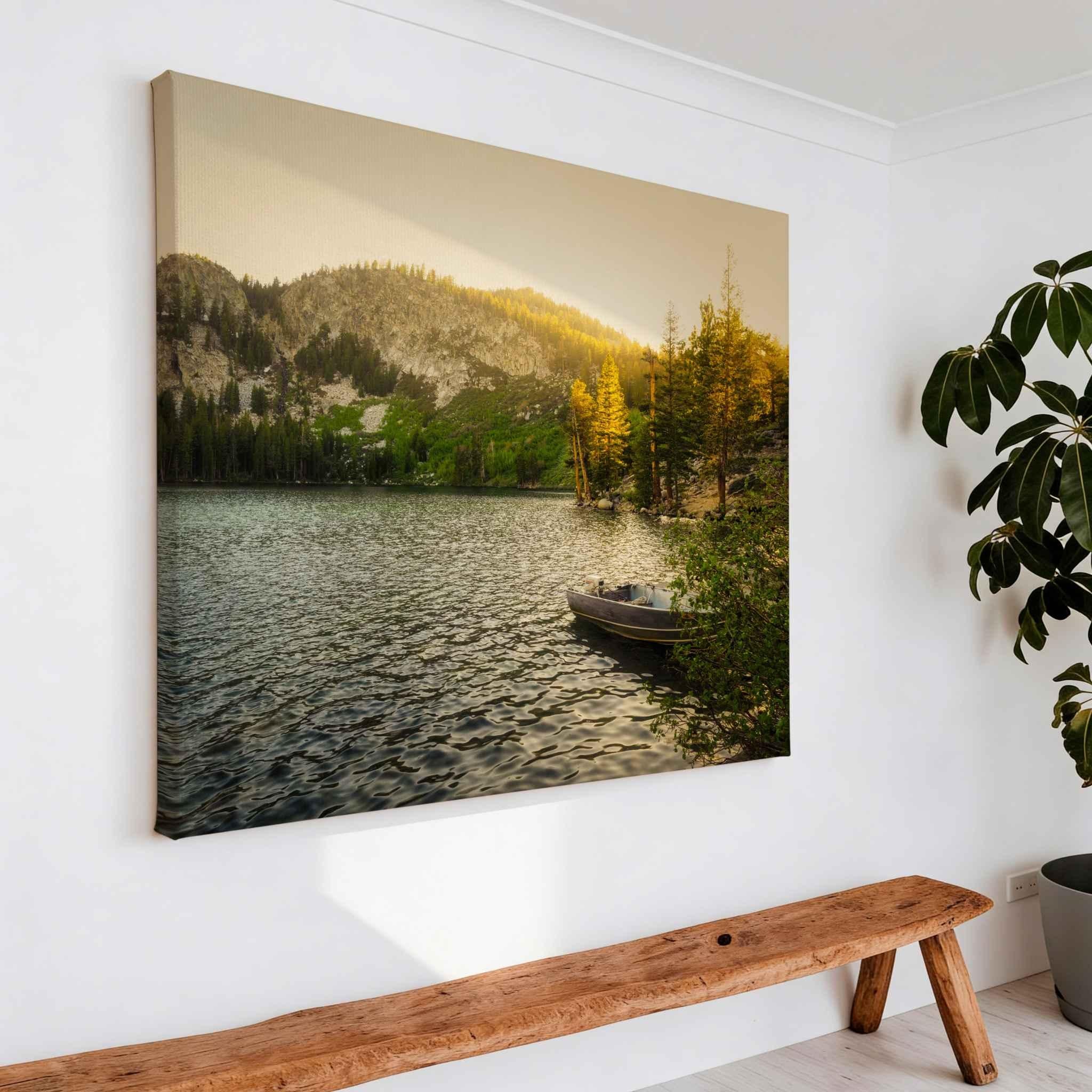 Golden Hour Alpine Lake canvas print of Lake George in Mammoth Lakes, California, displayed above a natural wood bench in a bright modern interior.