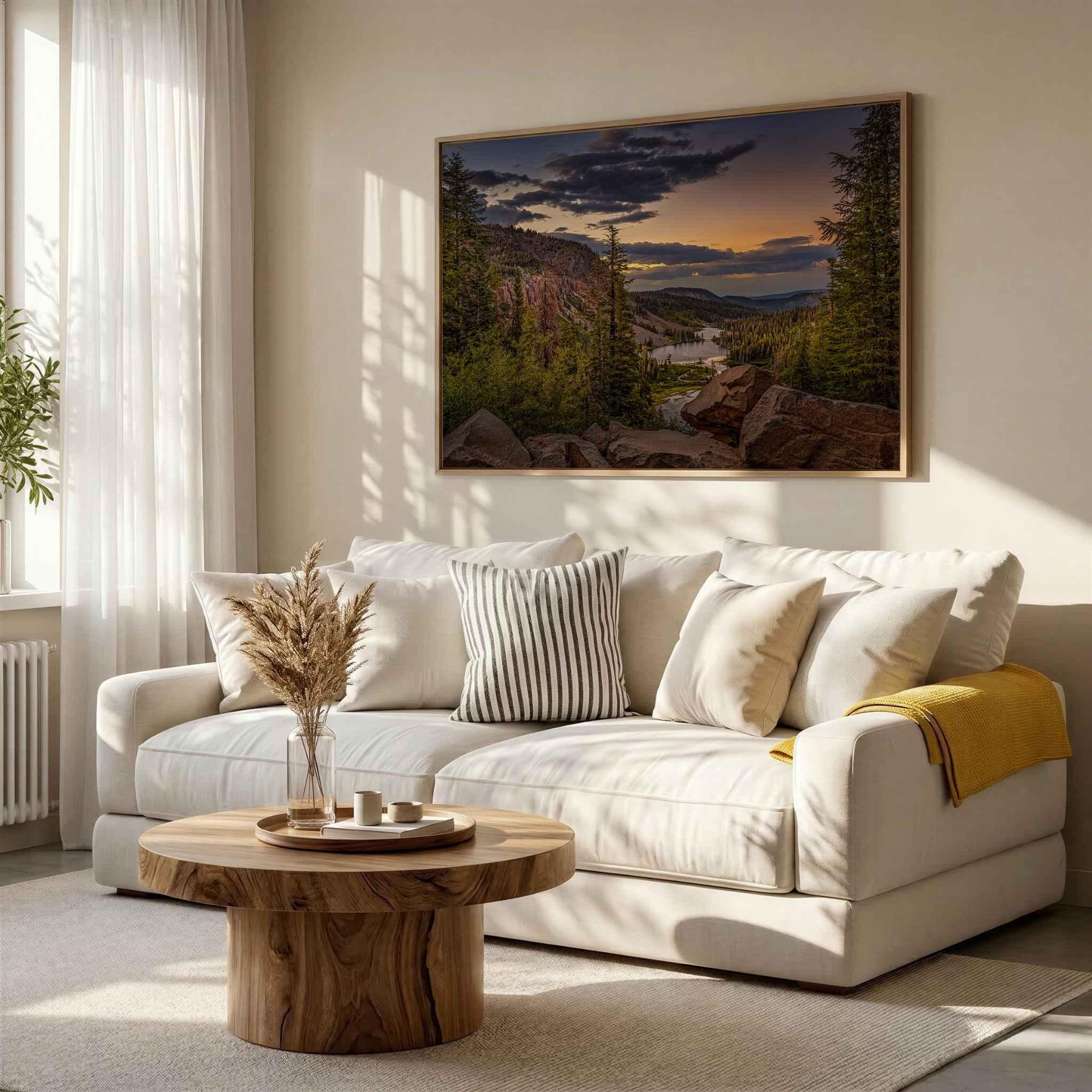 Golden Hour Twin Lakes California landscape wall art displayed above a neutral sofa, featuring an Eastern Sierra mountain lake at sunset.