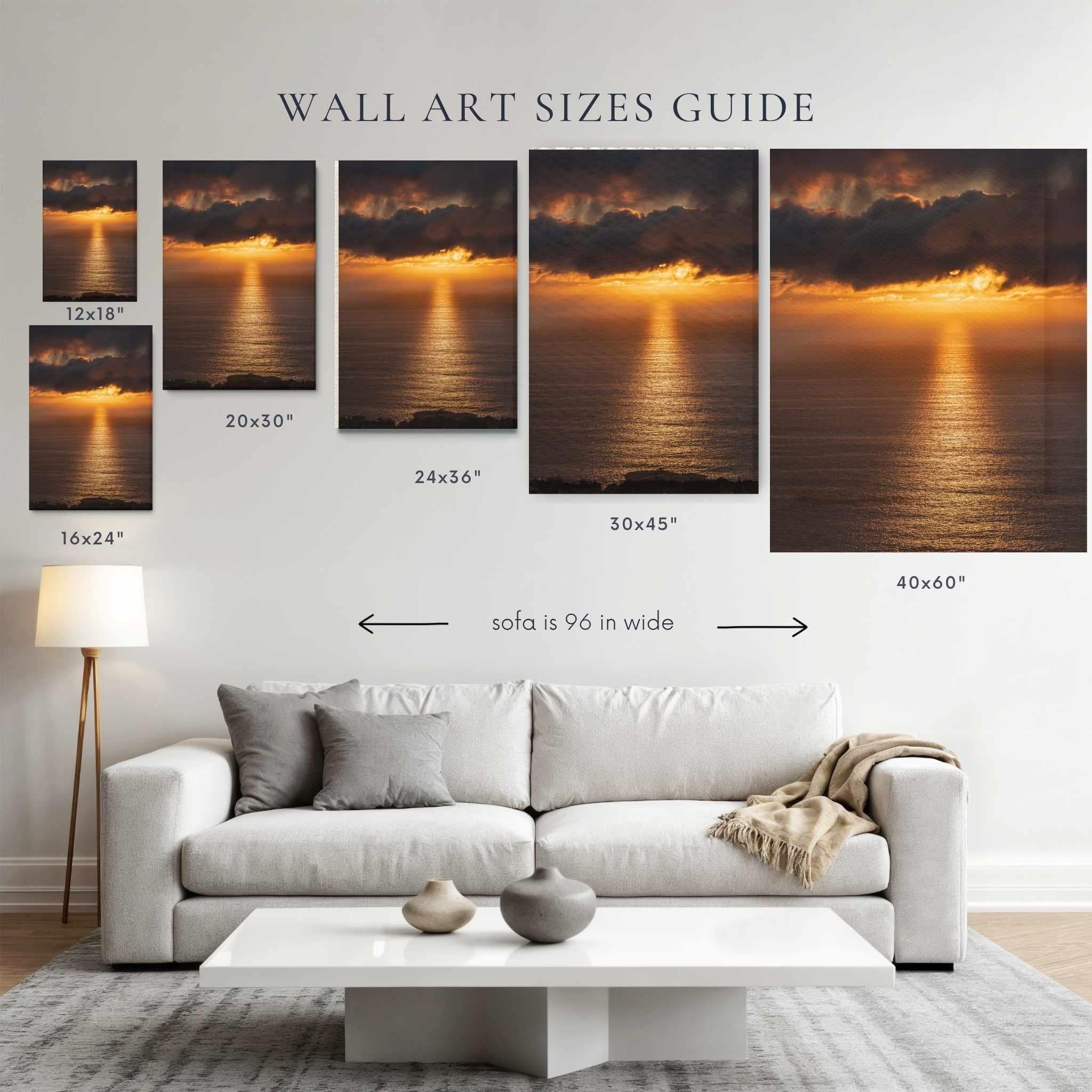 Wall art size guide golden rays on the mirrored sea in the pacific during a golden hour sunset by Abigail Diane Photography showing print sizes 12x18, 20x30,24x36 and 40 x 60 displayed above a 96-inch sofa for scale
