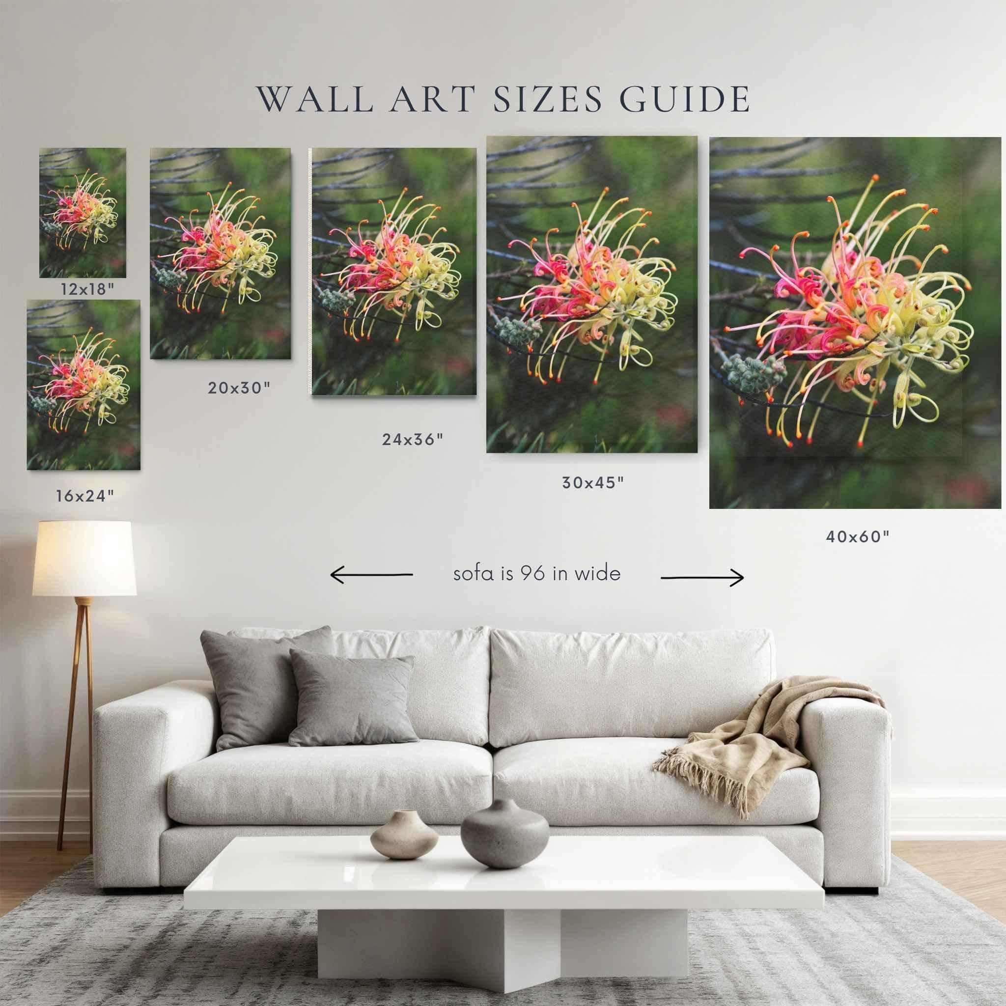 Wall art size guide showing gracefully-unfolding canvas print above a 96-inch sofa in 12x18, 16x24, 20x30, 24x36, 30x45, and 40x60 inch sizes to help visualize artwork scale in a living room.