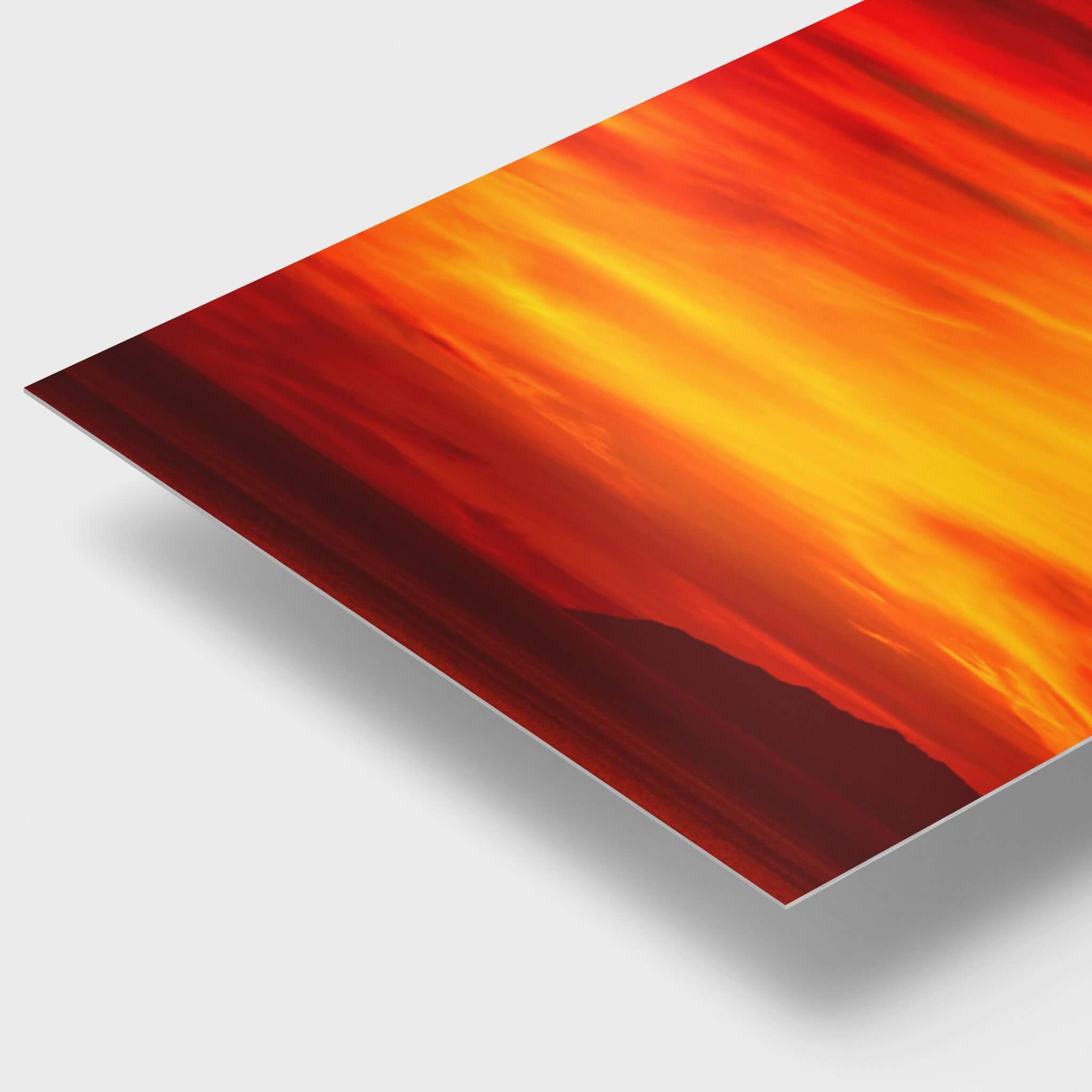 Close-up view of Inferno Sunset High-Definition metal print showing vivid red, orange and golden California sunset tones. Over the Pacific Ocean and Catalina Island.