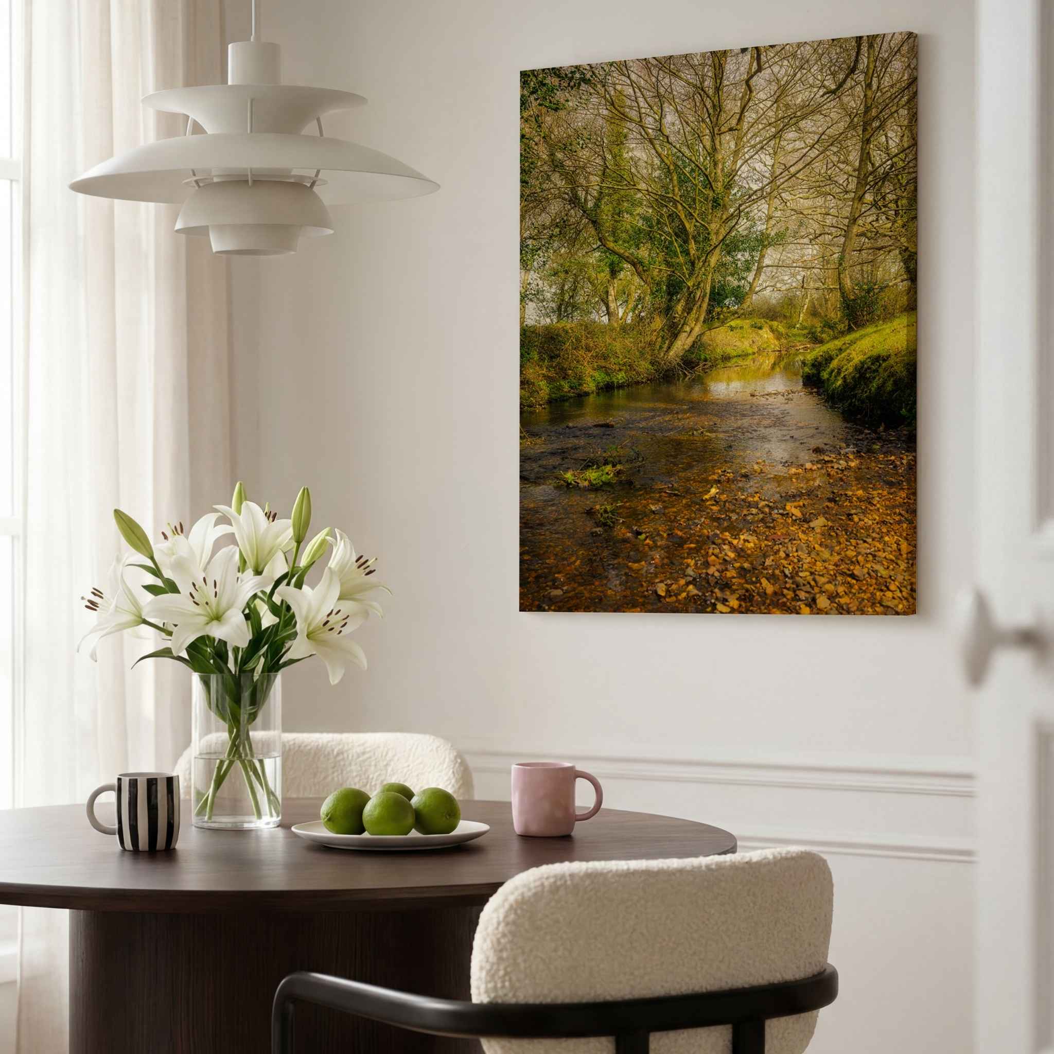 Lazy Creek in the New Forest, UK by Abigail Diane Photography displayed as a ChromaLuxe HD Metal Print in a bright contemporary dining room, featuring a tranquil woodland stream beneath ancient trees.
