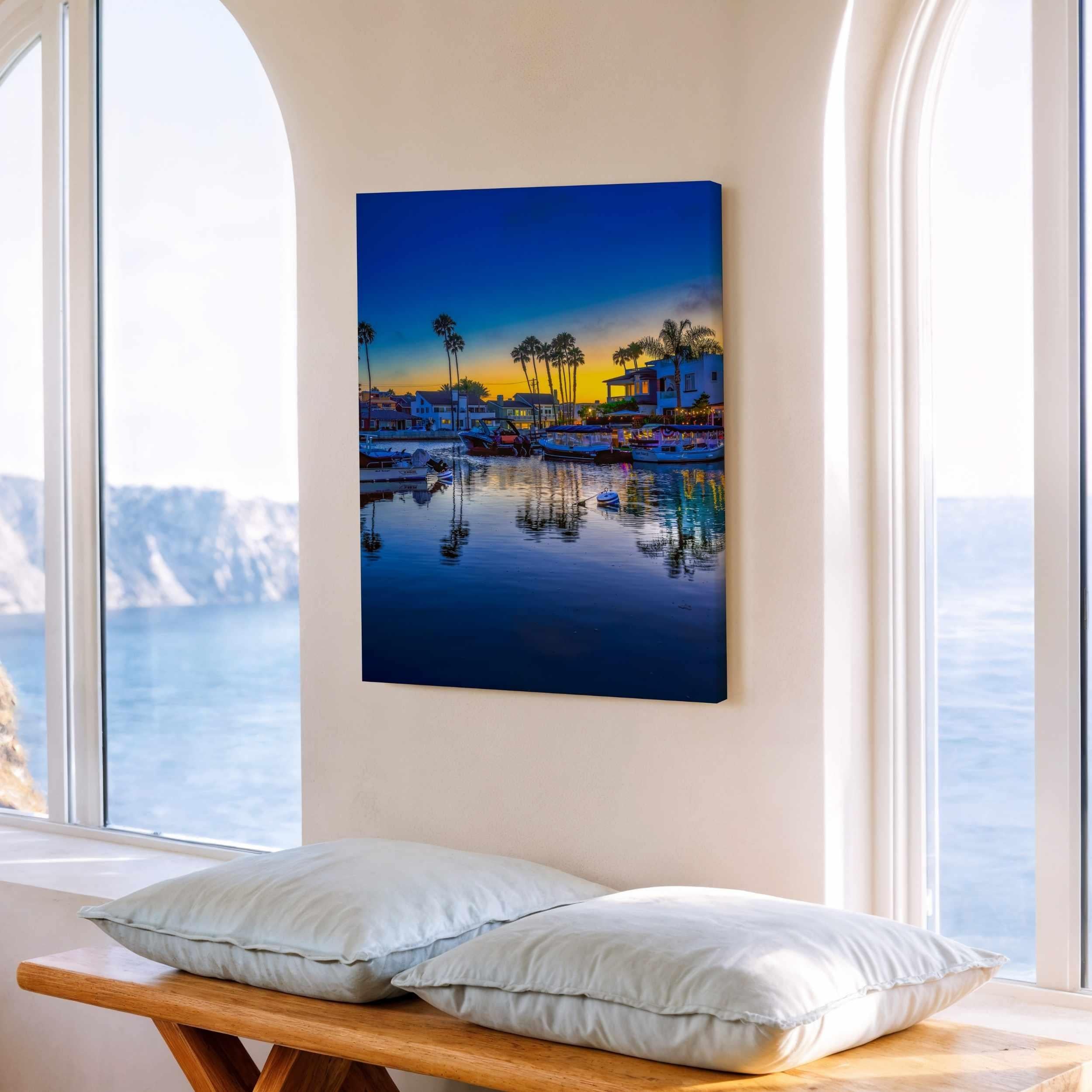 Magic of the Blue Hour canvas print by Abigail Diane Photography displayed in a bright coastal-inspired interior with waterfront views, featuring tranquil harbor reflections at sunset.