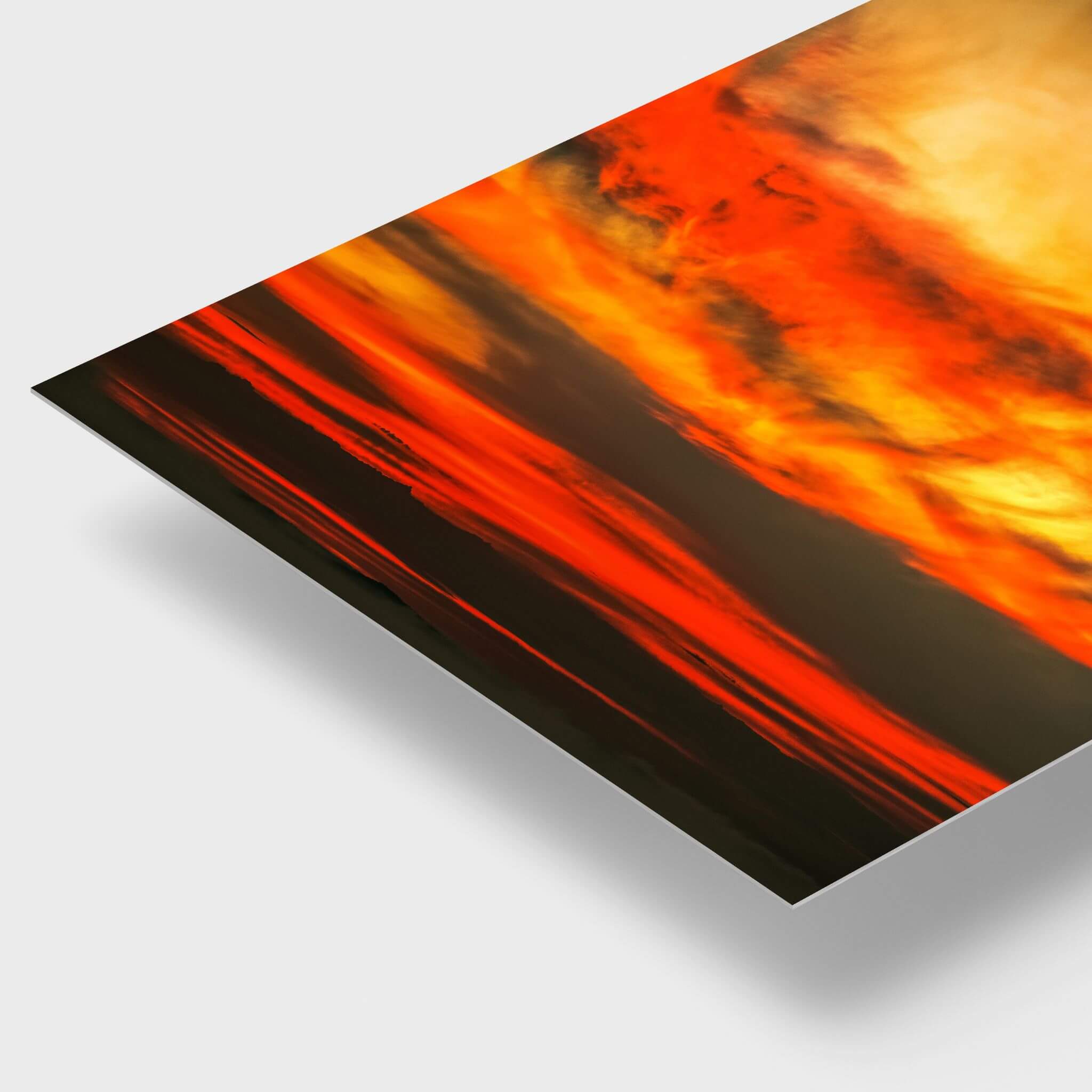 Close-up detail of Painted Lady High Definition metal print by Abigail Diane Photography, showcasing vivid golden yellow, fiery orange, deep red and charcoal sunset clouds with the sleek edge and contemporary finish of the metal print.