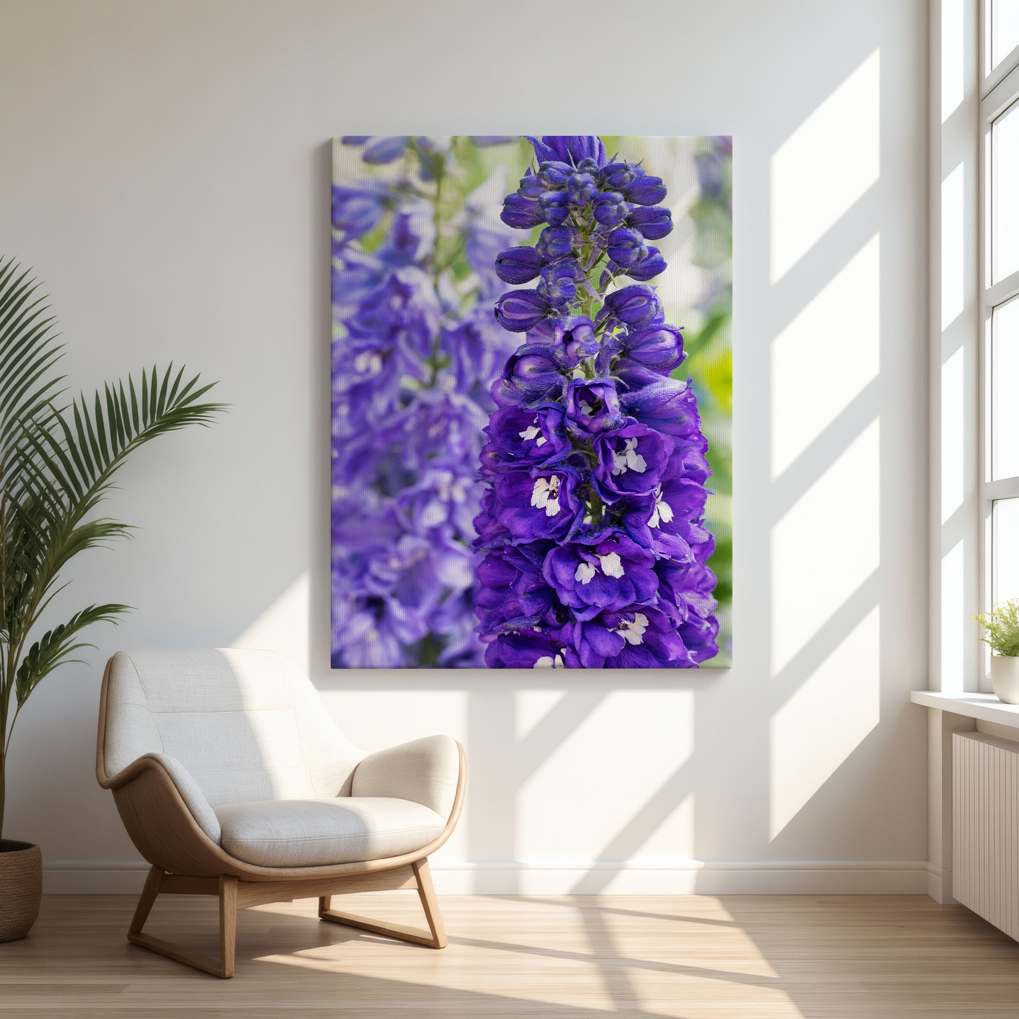 Purple delphinium botanical canvas print displayed in a bright modern interior with natural wood chair and soft window light – Abigail Diane Photography