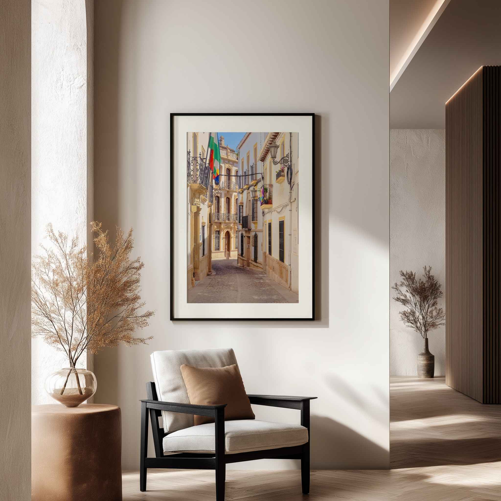 Ronda Spain street photography displayed as a framed fine art print in a warm modern interior – Abigail Diane Photography.