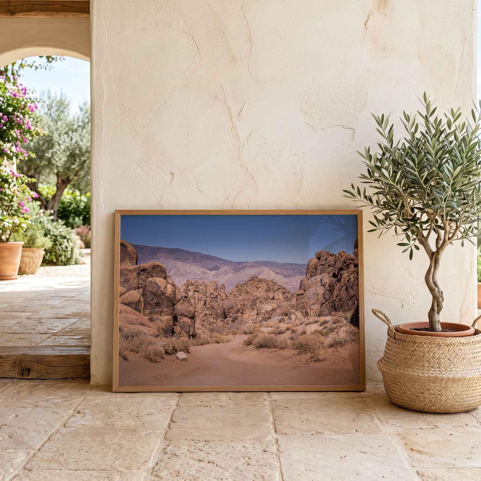 Sierra Desert Passage framed fine art print featuring the Alabama Hills in California’s Eastern Sierra, styled in a warm natural interior beside an olive tree.