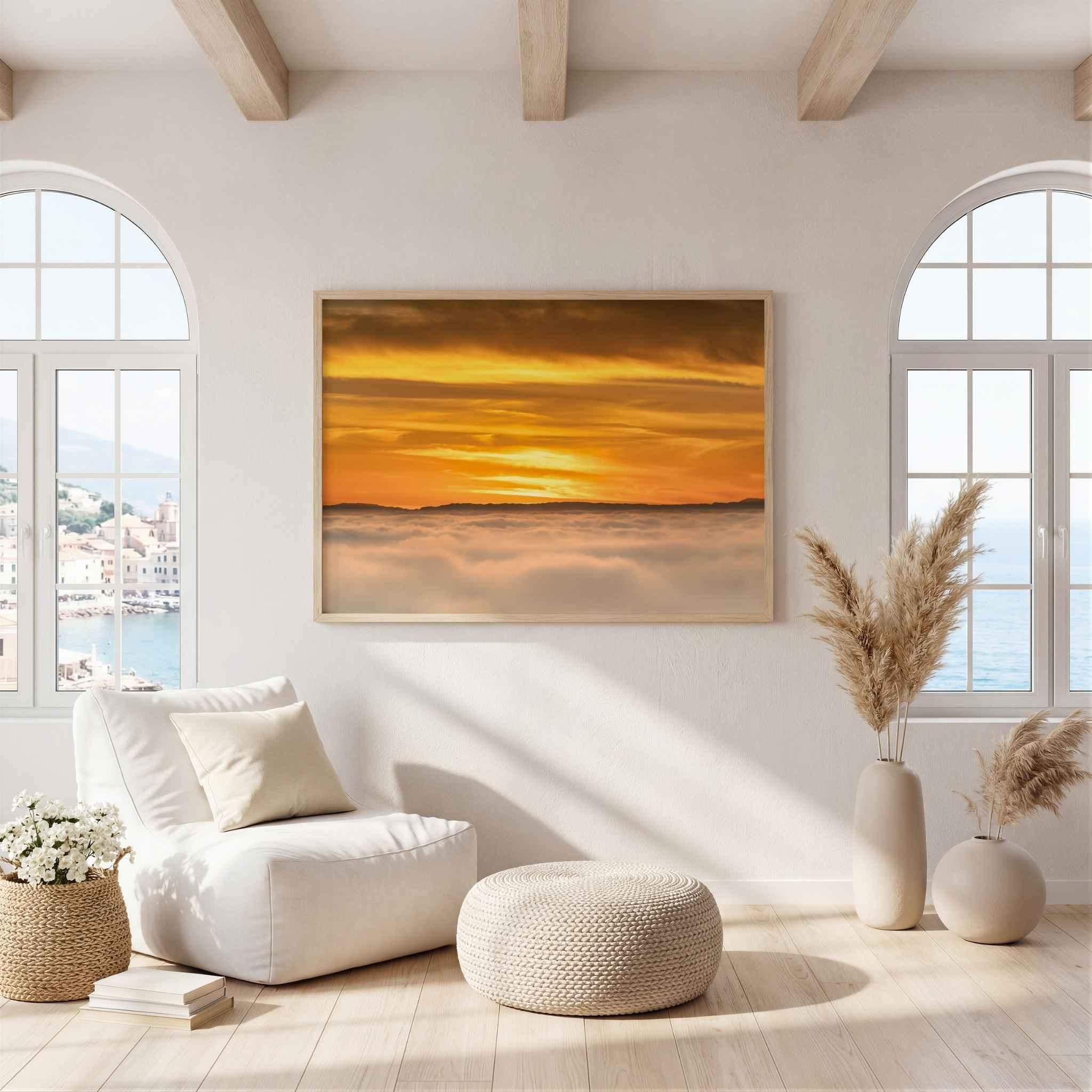 Soaring Above the Clouds framed fine art print displayed in a bright coastal-inspired living room, featuring a golden winter sunset above a sea of clouds with Catalina Island on the Pacific horizon. Artwork by Abigail Diane Photography.