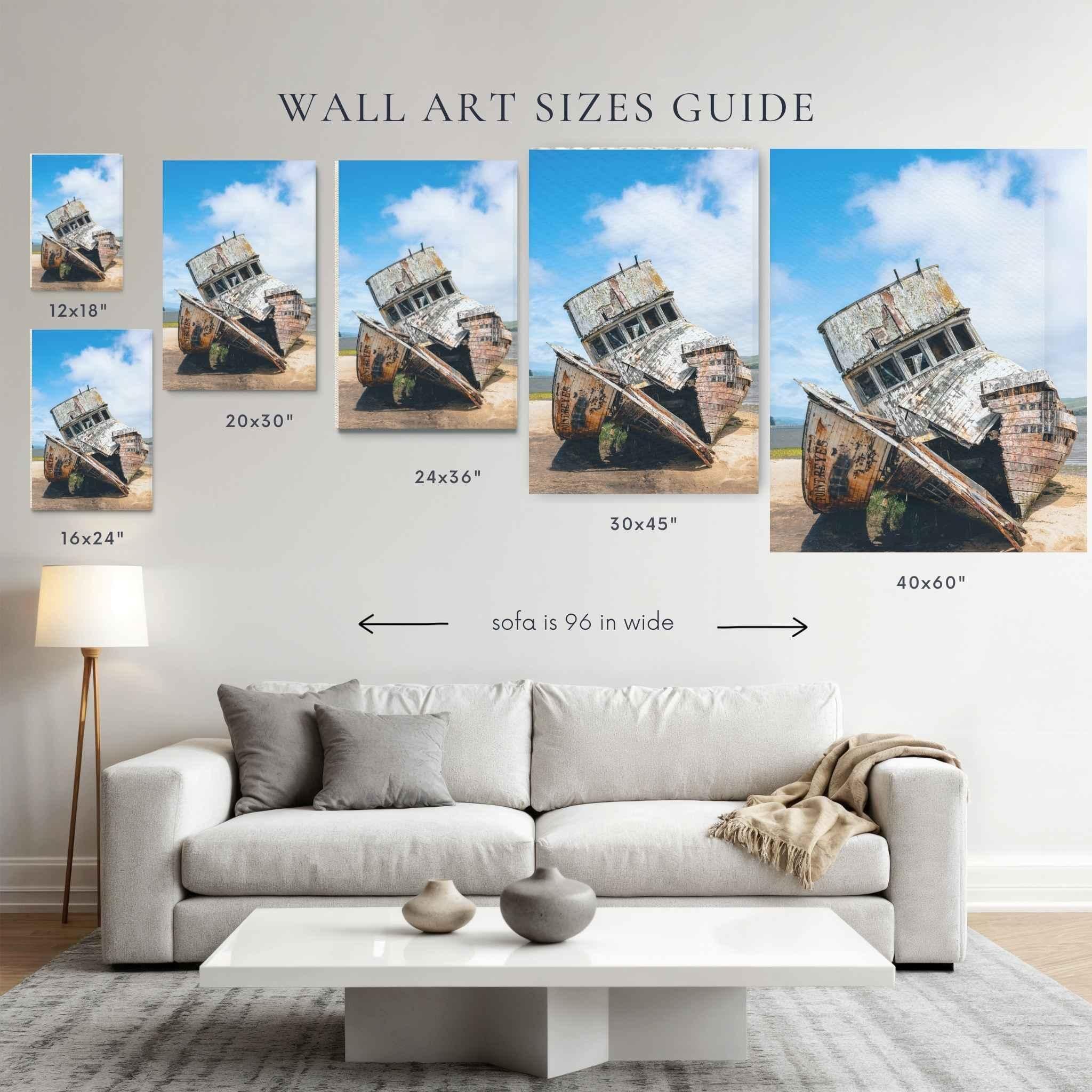 Wall art size guide featuring Weathered Echoes of the S.S. Point Reyes by Abigail Diane Photography, showing available print sizes 12x18, 16x24, 20x30, 24x36, 30x45, and 40x60 inches above a 96-inch sofa. Coastal shipwreck photography from Tomales Bay, California displayed as fine art wall décor size comparison chart.