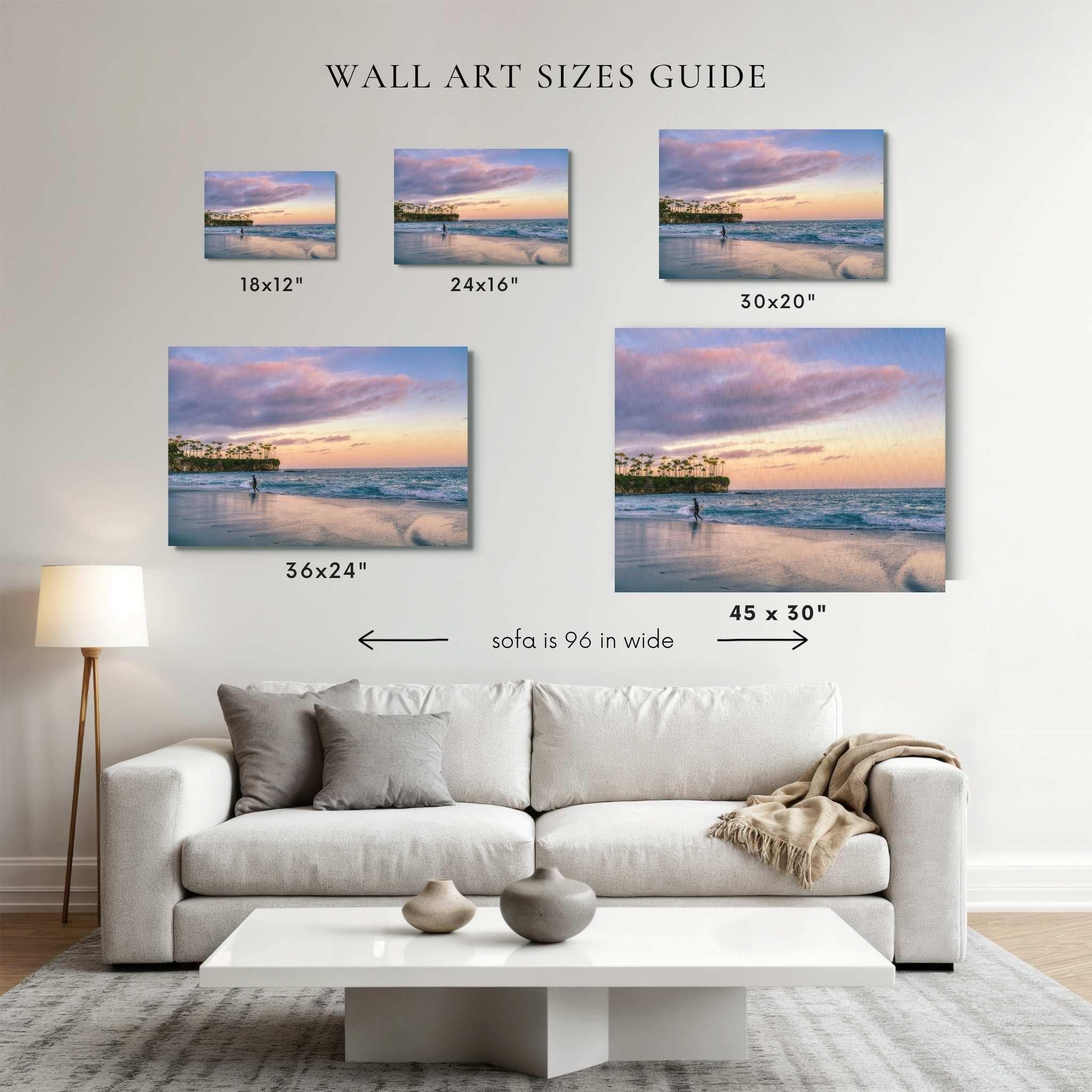anvas wall art size guide for Surfing a California Sunset by Abigail Diane Photography, comparing 18×12, 24×16, 30×20, 36×24, and 45×30 inch prints above a modern sofa for size reference.