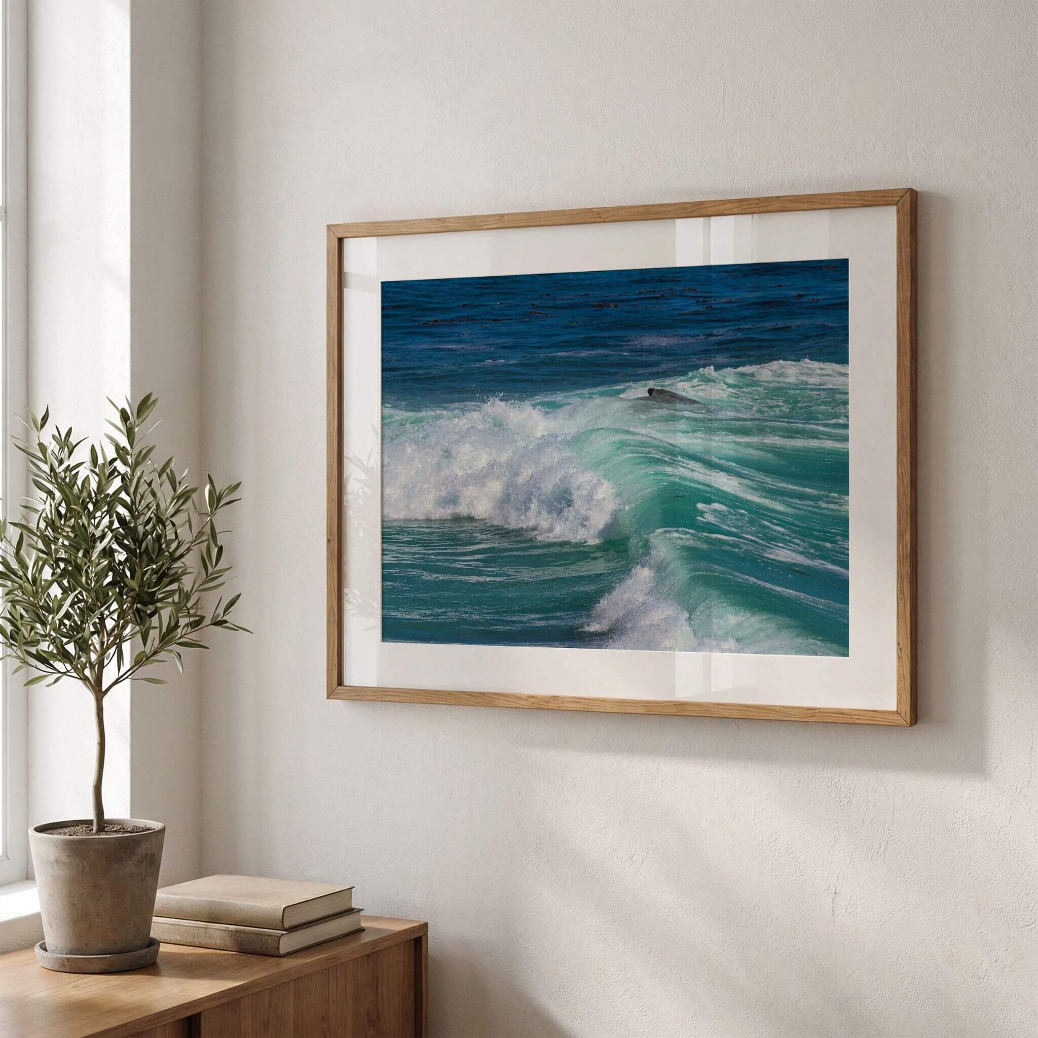 Framed fine art print of Turquoise Healing Waves displayed on a modern wall, featuring vibrant turquoise waves breaking across the Pacific Ocean in Laguna Beach, California. Coastal photography wall art by Abigail Diane Photography.