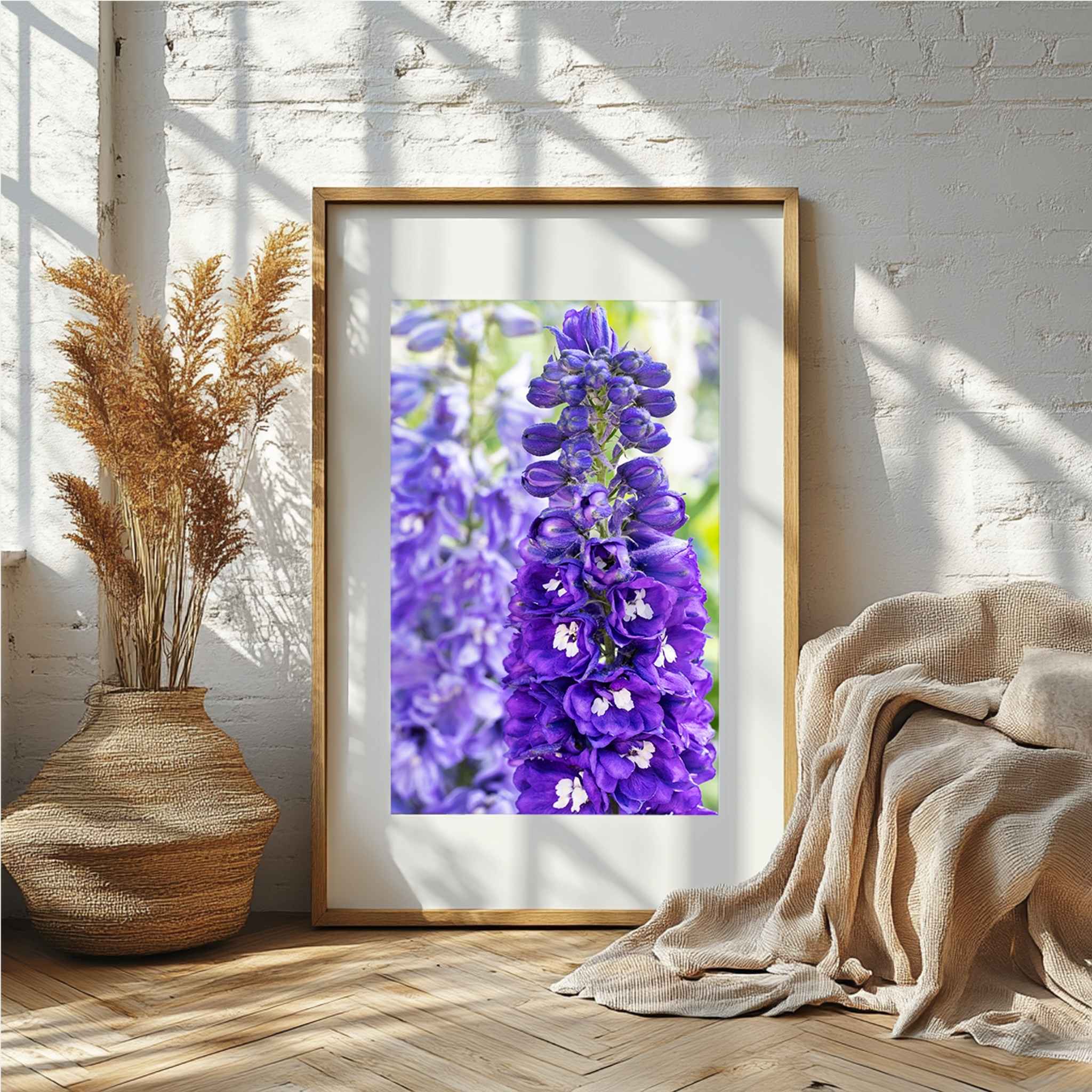 Violet Harmony purple larkspur framed fine art print in a natural wood frame displayed in a warm neutral interior by Abigail Diane Photography.