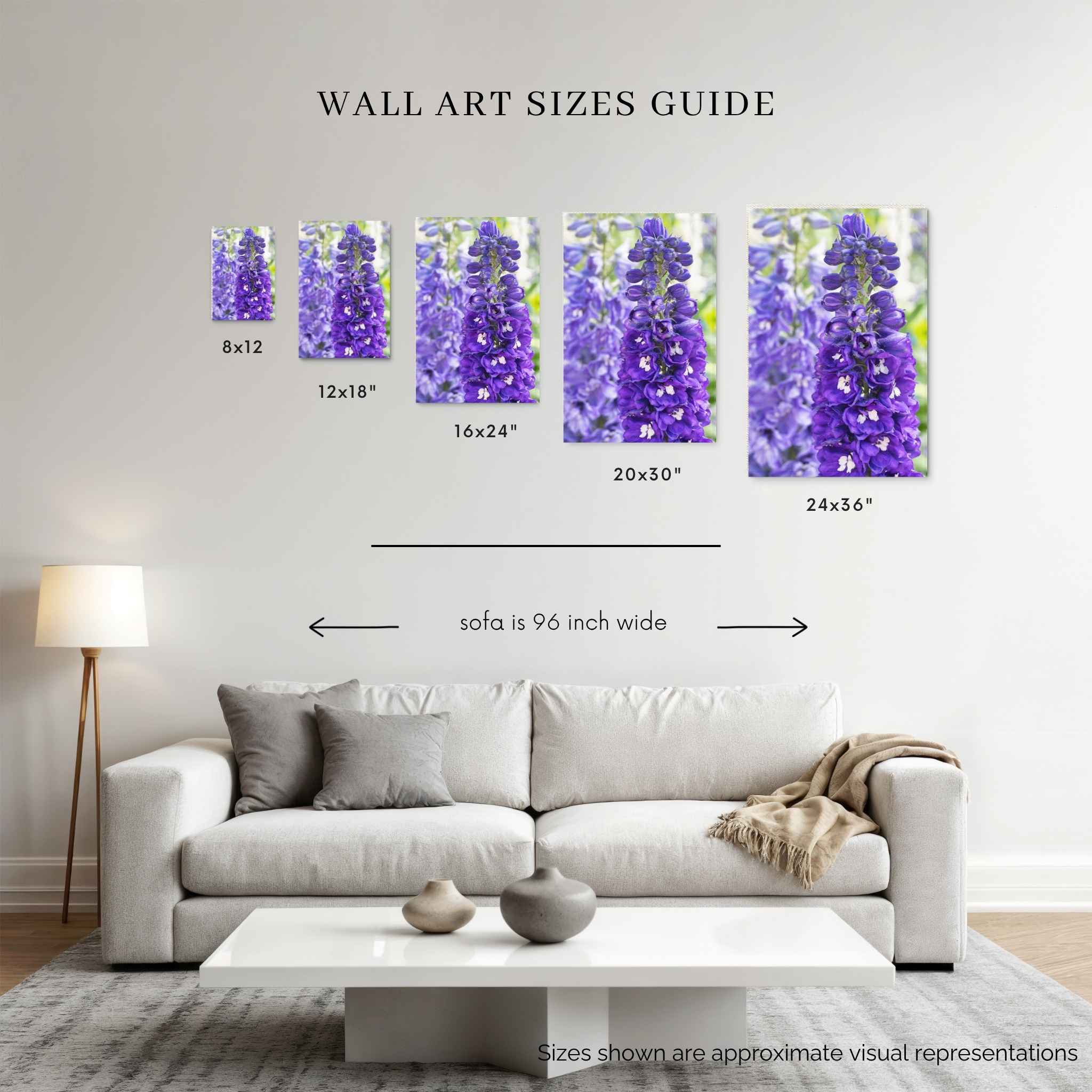 Violet Harmony purple larkspur wall art size guide showing print sizes from 8x12 to 24x36 inches above a 96-inch sofa by Abigail Diane Photography.