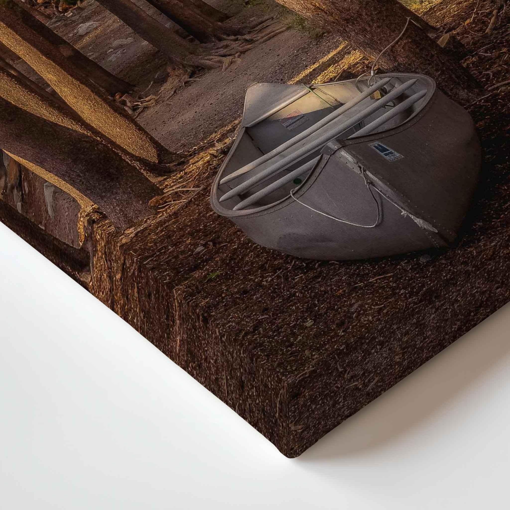 Close-up corner detail of Waiting for the Water canvas print, showing the gallery-wrapped edge and canoe resting among the trees in Mammoth Lakes, California.