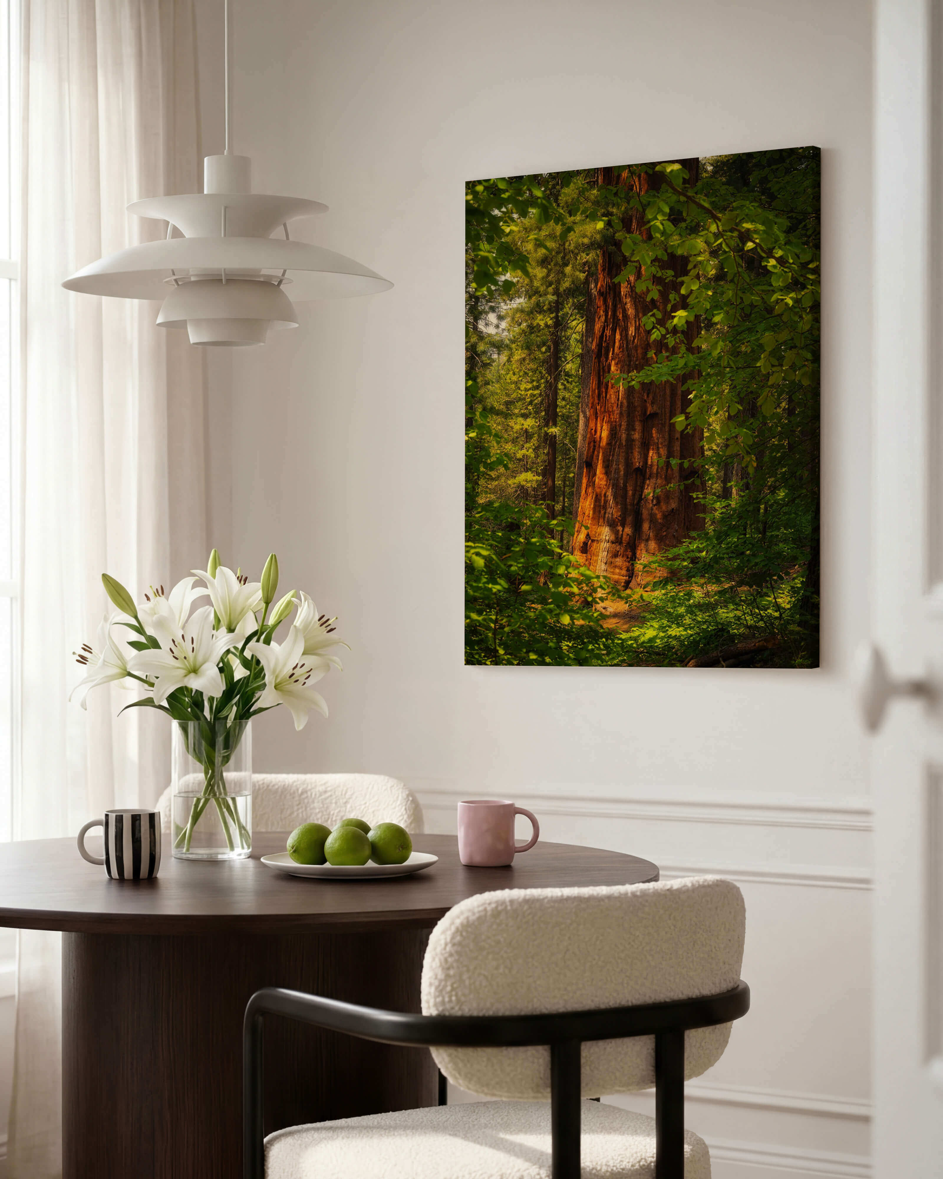 Where the Giants Awaken canvas wall art by Abigail Diane Photography featuring a sunlit giant sequoia in Mariposa Grove, Yosemite National Park, displayed in a contemporary dining room.