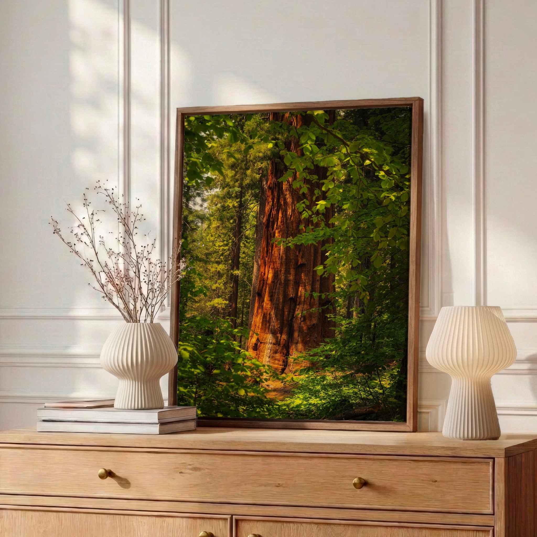 Where the Giants Awaken framed fine art print by Abigail Diane Photography displayed on a wooden dresser, featuring a towering giant sequoia in Yosemite National Park, California.