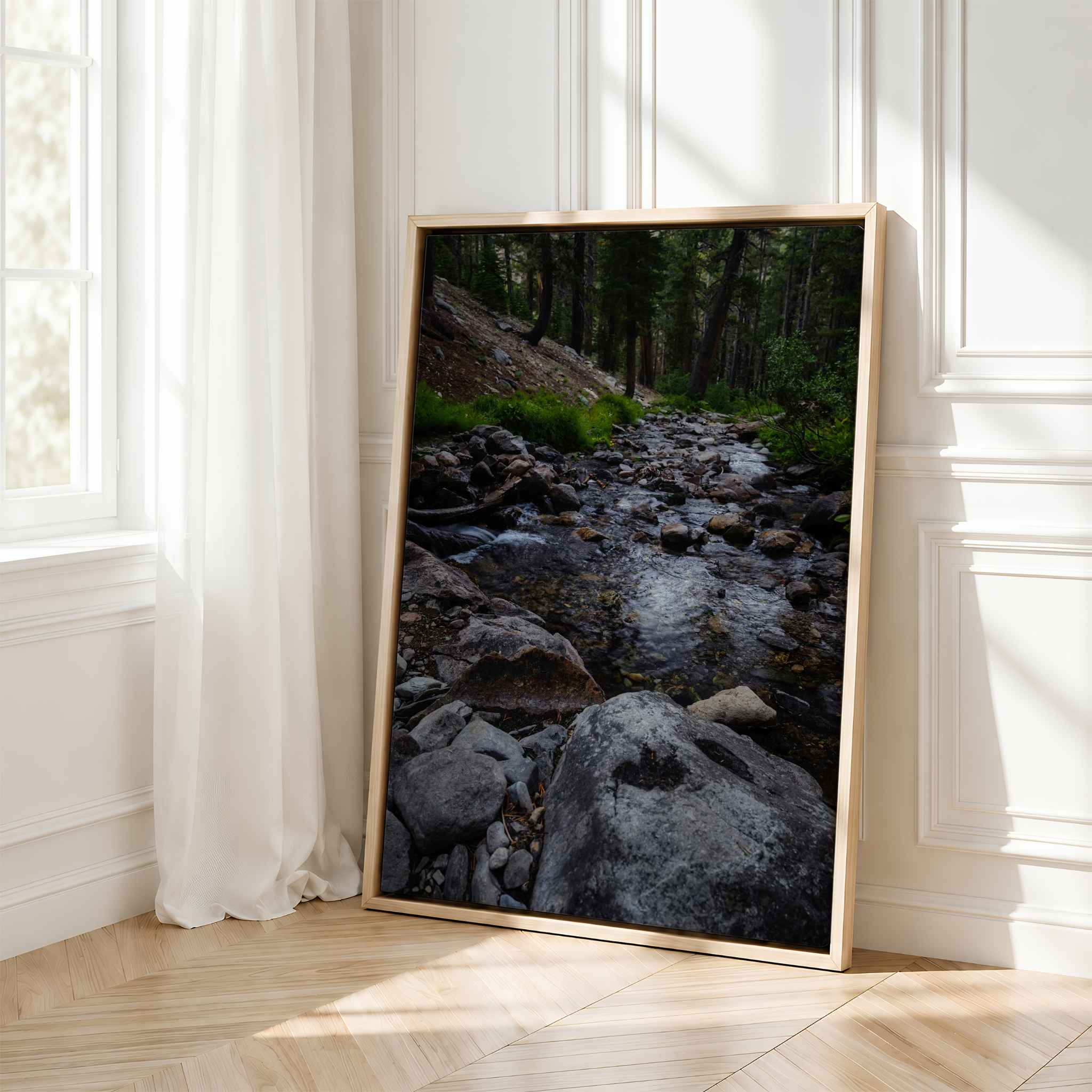 Where the Stepping Stones Lead framed fine art print featuring a rocky mountain stream in the Eastern Sierra, California, displayed in a bright neutral interior.