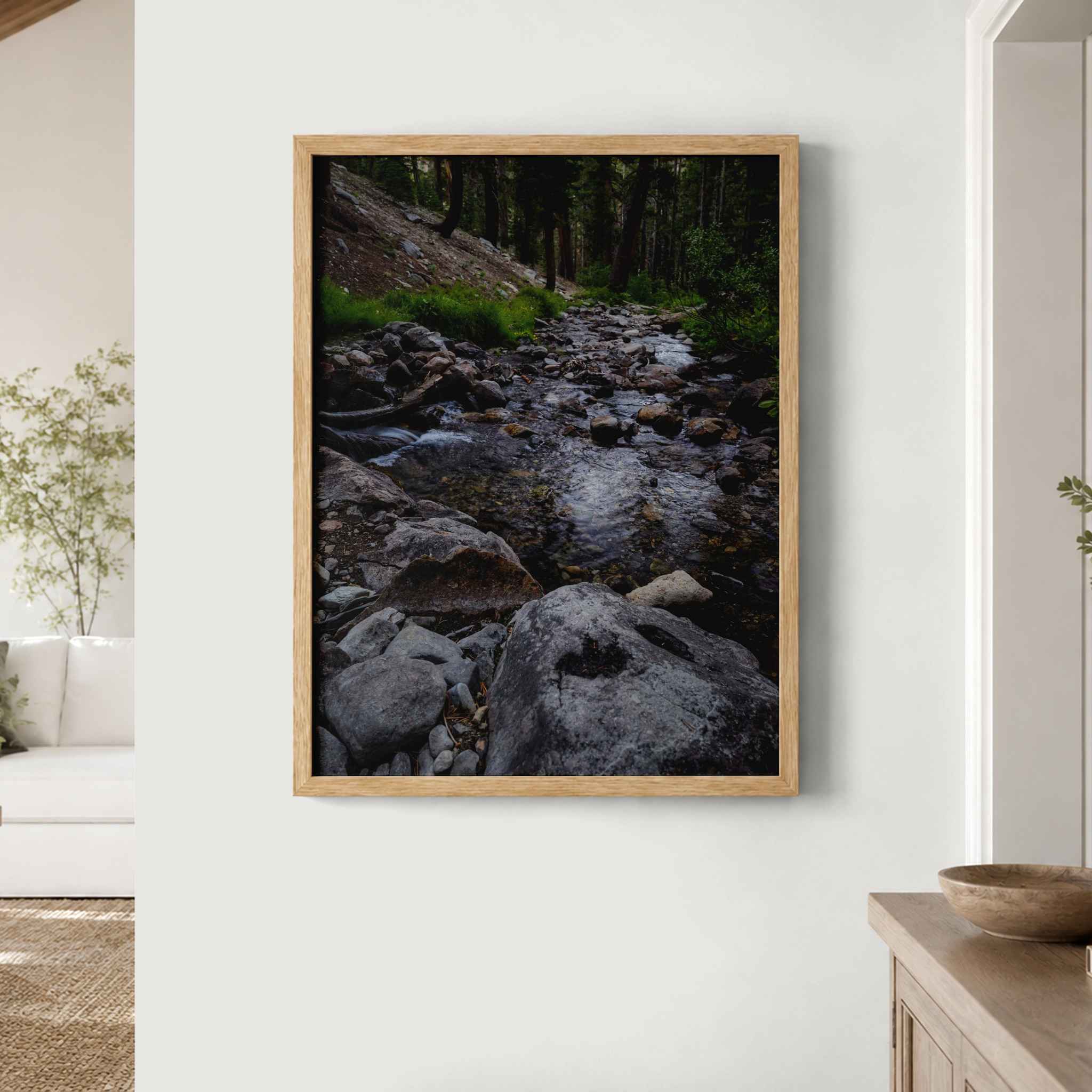 Where the Stepping Stones Lead fine art print featuring a rocky forest stream in the Eastern Sierra, California, presented in a natural wood frame.