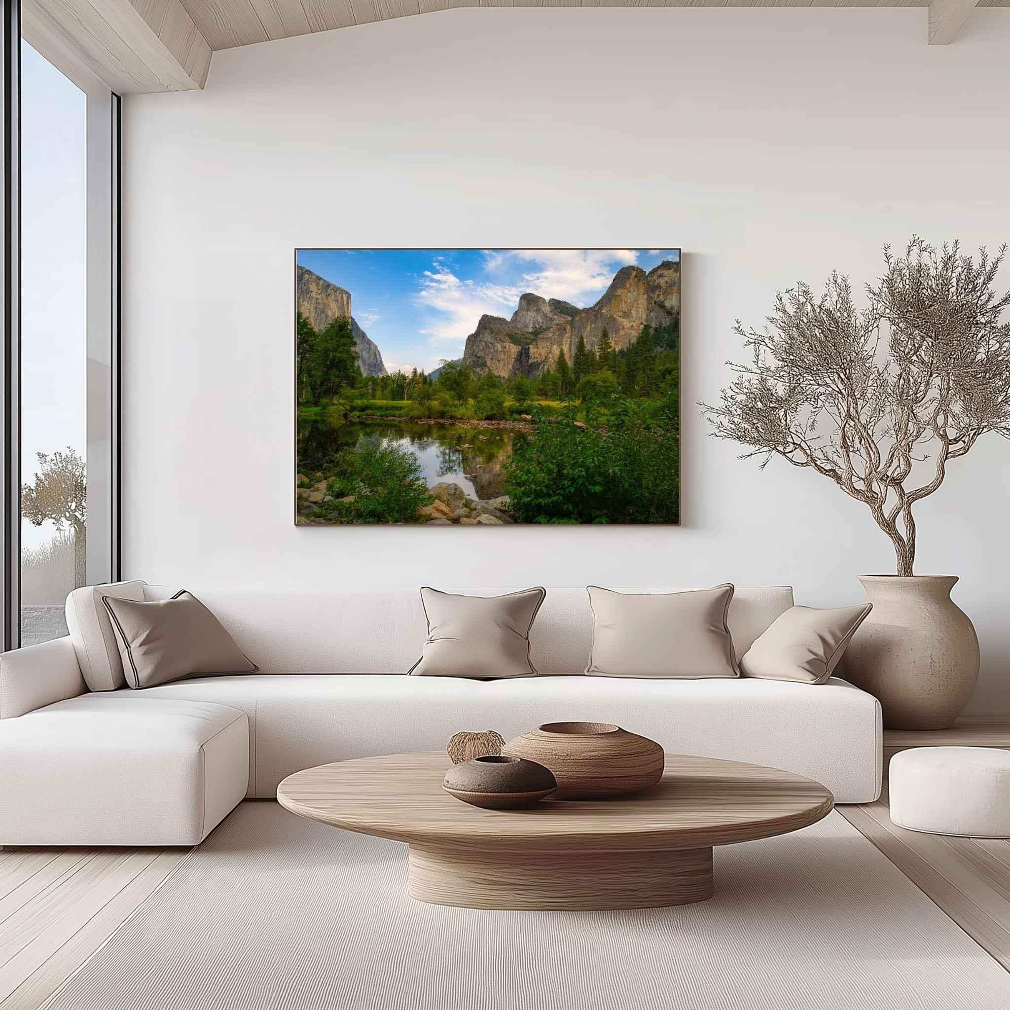 Yosemite Valley canvas wall art by Abigail Diane Photography displayed in a modern luxury living room above a white sofa with natural wood furniture and neutral décor.