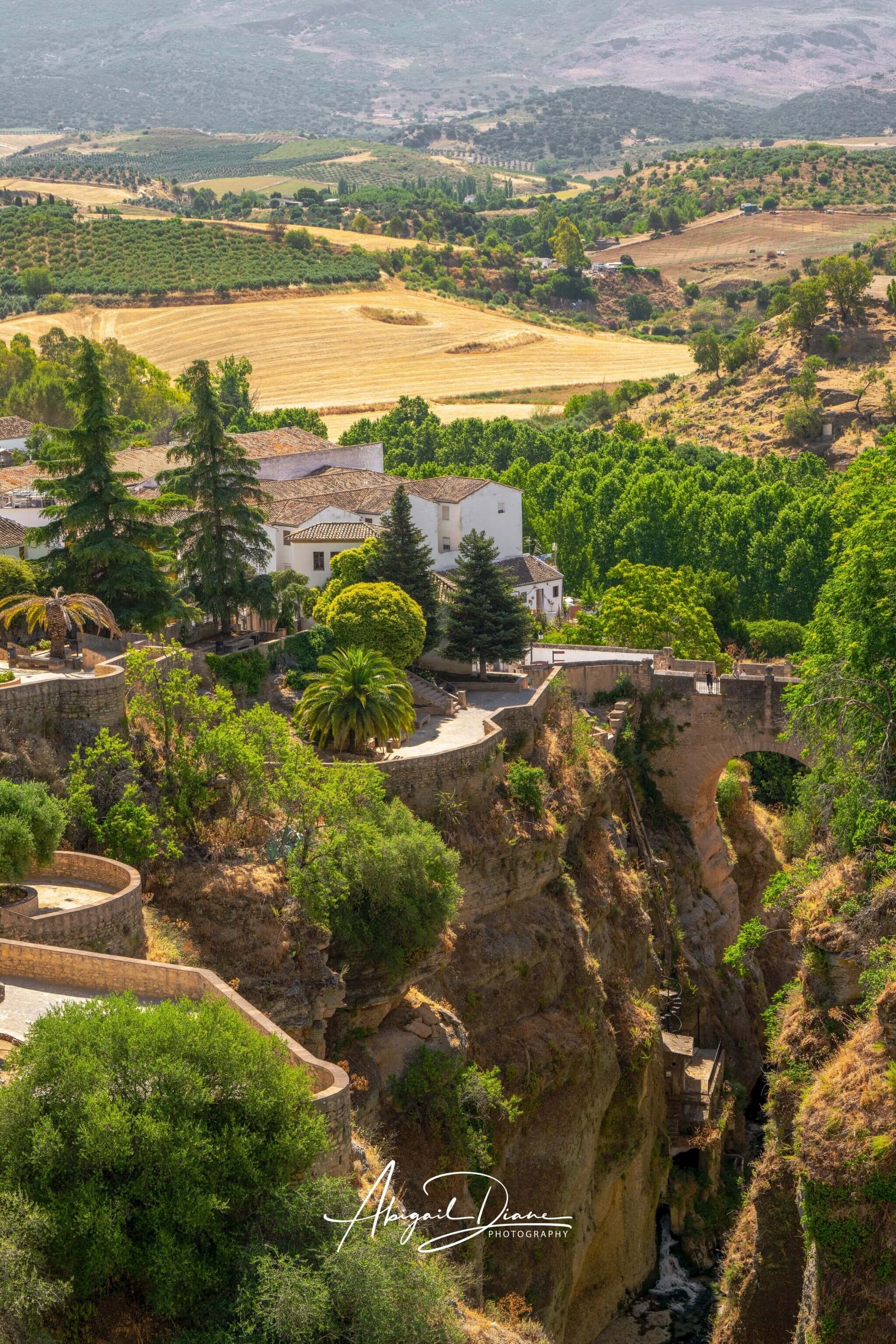 Ronda Above the Gorge featuring historic whitewashed buildings, the dramatic El Tajo Gorge and sweeping Andalusian landscape in Ronda, Spain – Abigail Diane Photography