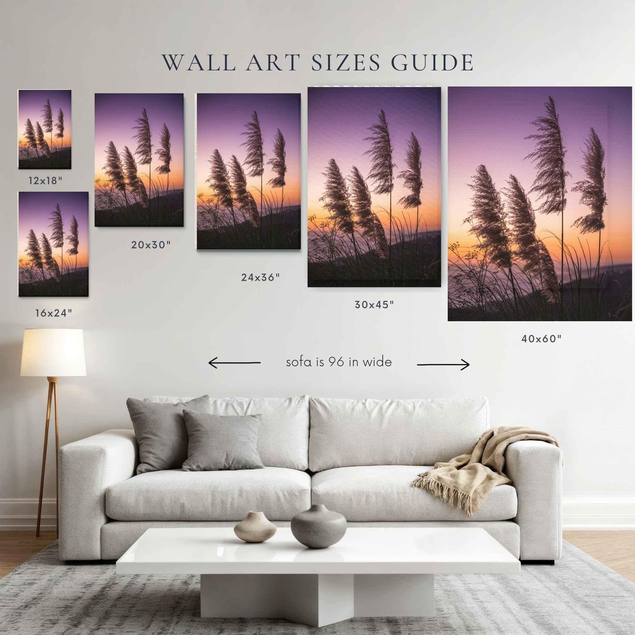 Coastal pampas grass sunset  fine art print by Abigail Diane Photography displayed in a wall art size guide above a modern cream sofa, showcasing popular wall art sizes for home décor and interior design.