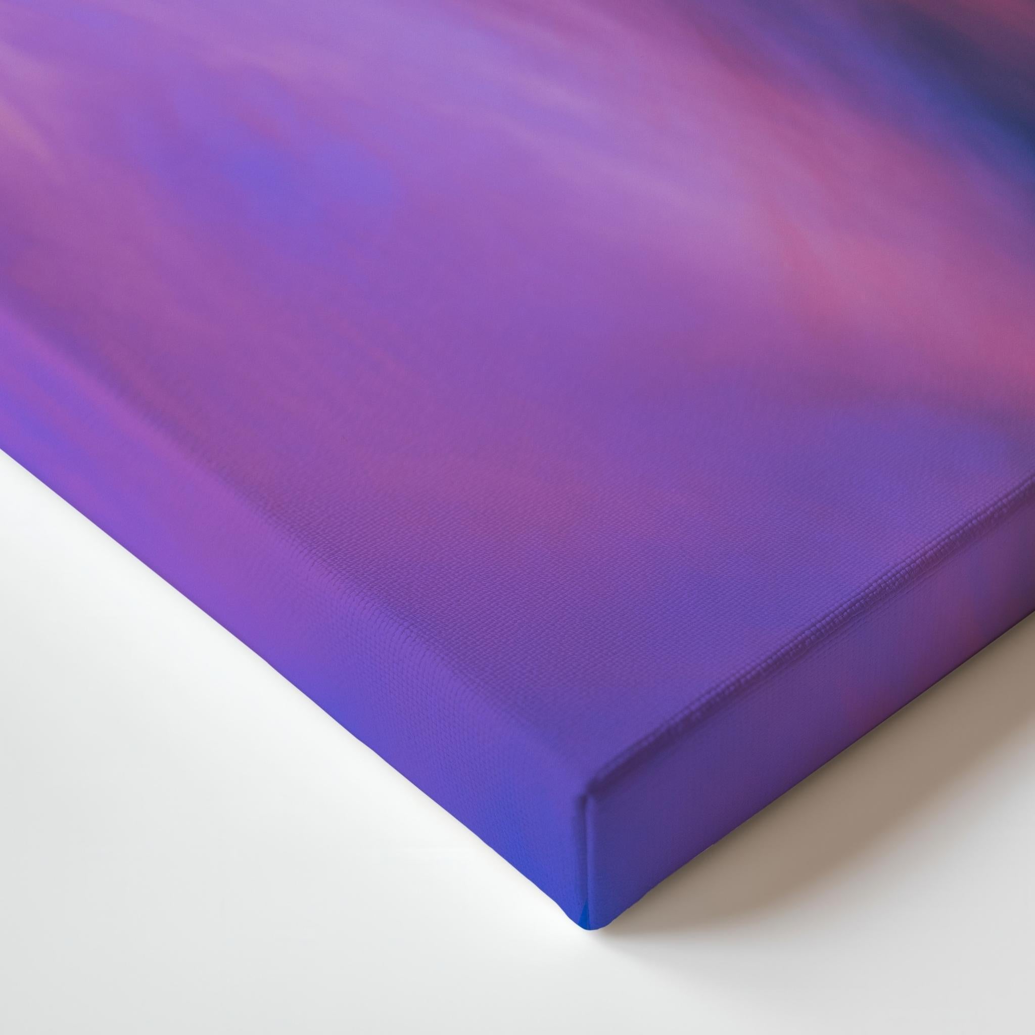 A close-up of lavender dreams gallery wrapped canvas with a smooth gradient surface transitioning from purple to pink, resting on a white surface. Photographed by Abigail Diane Photography