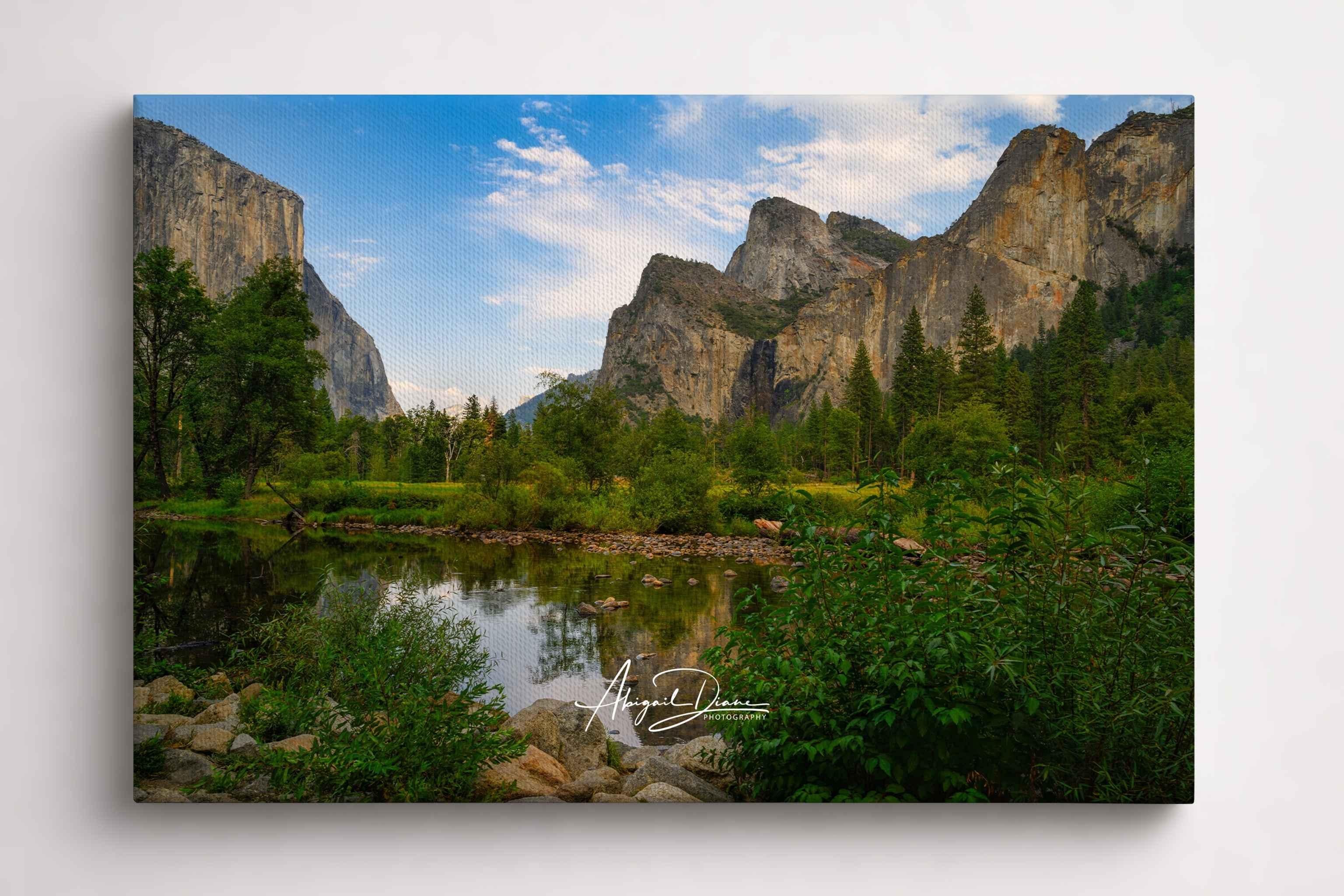 A Majestic Day in Yosemite Valley captures El Capitan, Bridalveil Fall, and the Merced River surrounded by towering granite cliffs in Yosemite National Park, California. Archival canvas print by Abigail Diane Photography.