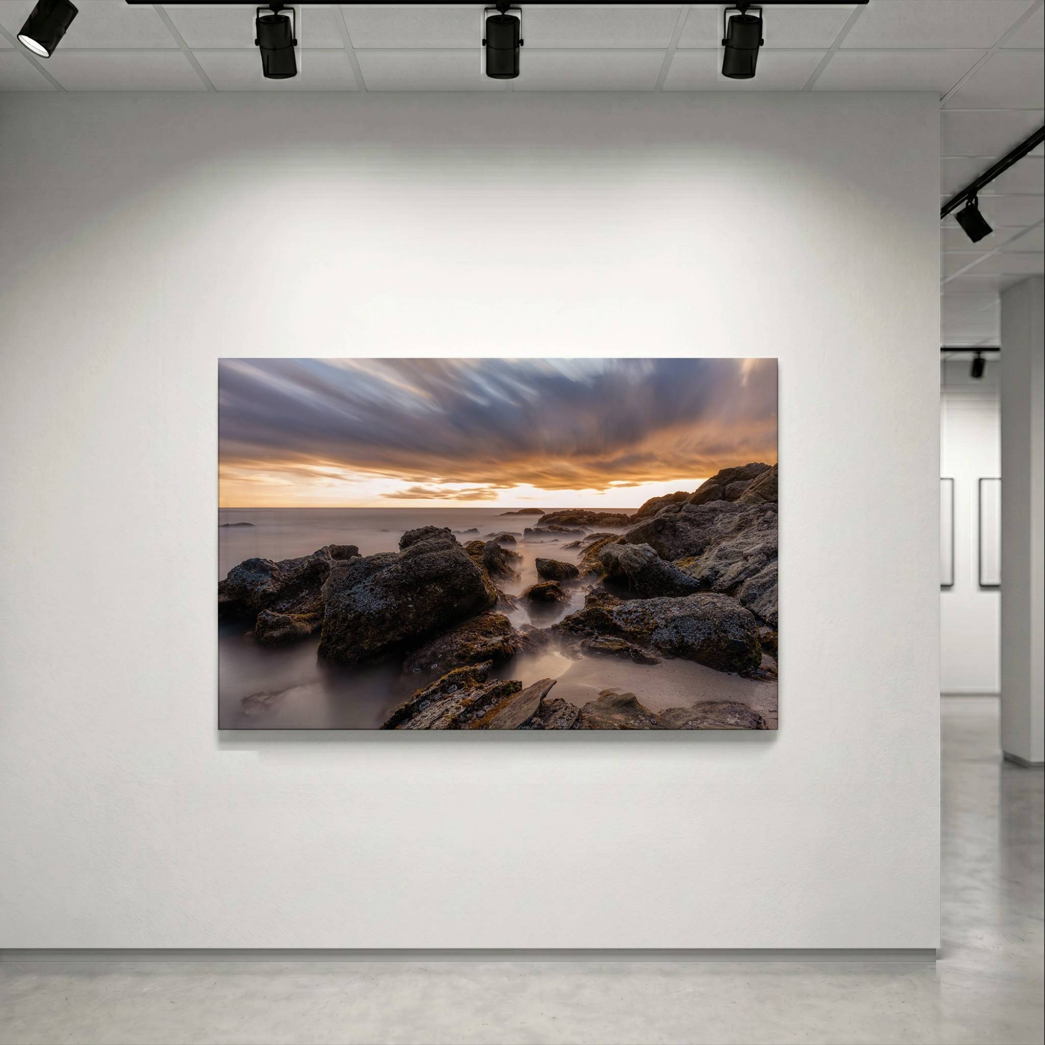 
After the Storm Chromaluxe dye-sublimation metal print by Abigail Diane Photography displayed in a contemporary gallery setting, featuring dramatic clouds, rugged coastal rocks, and a tranquil long-exposure sunset at Laguna Beach, California.