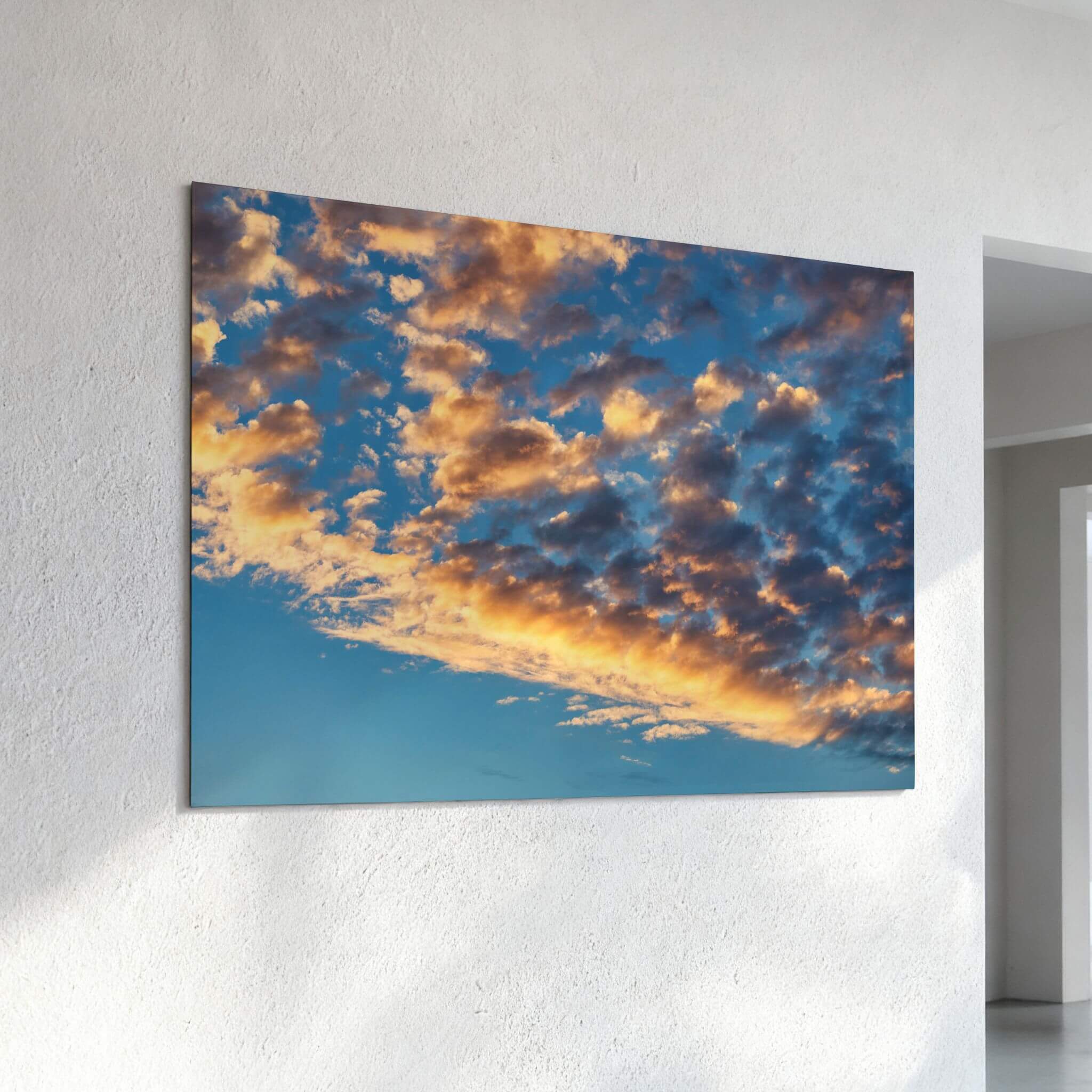 Blue and Gold Symphony dye-sublimation metal print displayed on a textured white wall in a bright contemporary interior. Photography by Abigail Diane Photography.