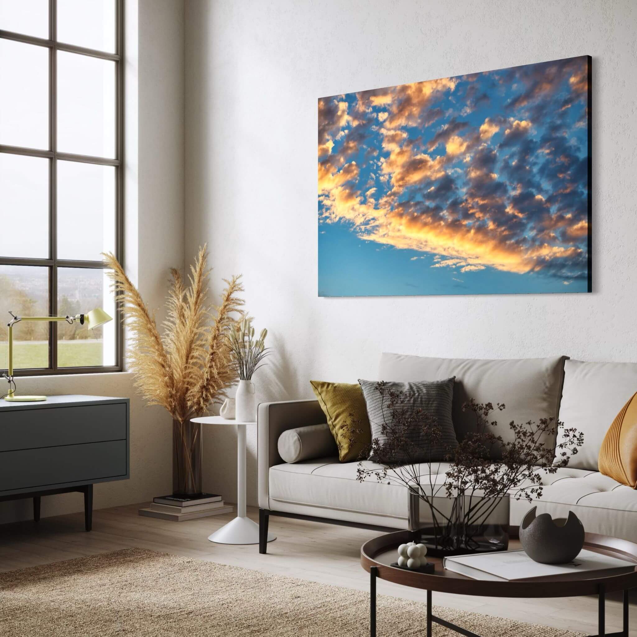 Blue and Gold Symphony of the sky metal print displayed above a neutral sofa in a contemporary living room with warm natural accents. Photography by Abigail Diane.