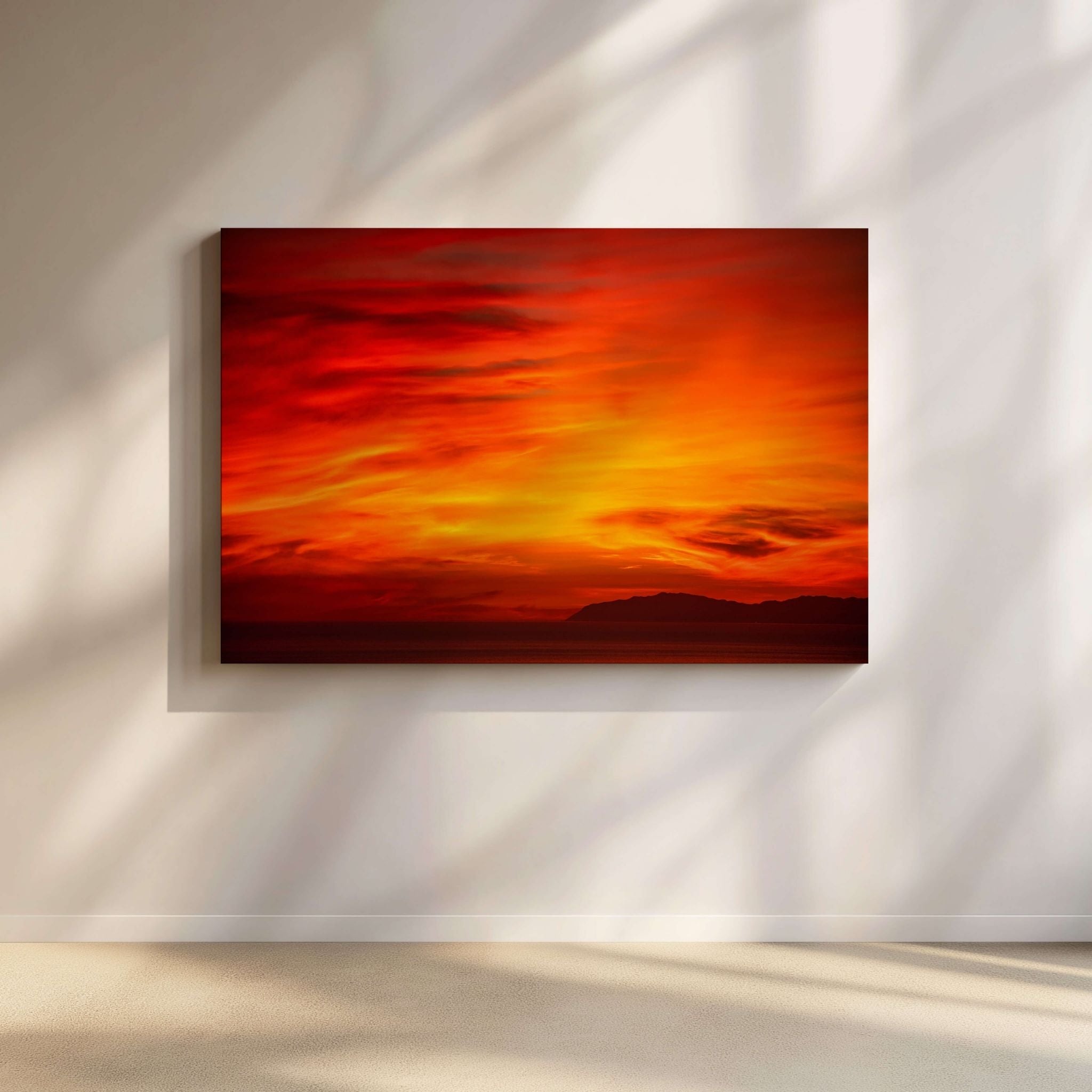 Catalina Beneath Crimson Skies gallery-wrapped canvas by Abigail Diane Photography displayed above a modern console in a contemporary neutral interior, featuring a dramatic crimson sunset over Catalina Island and the Pacific Ocean.