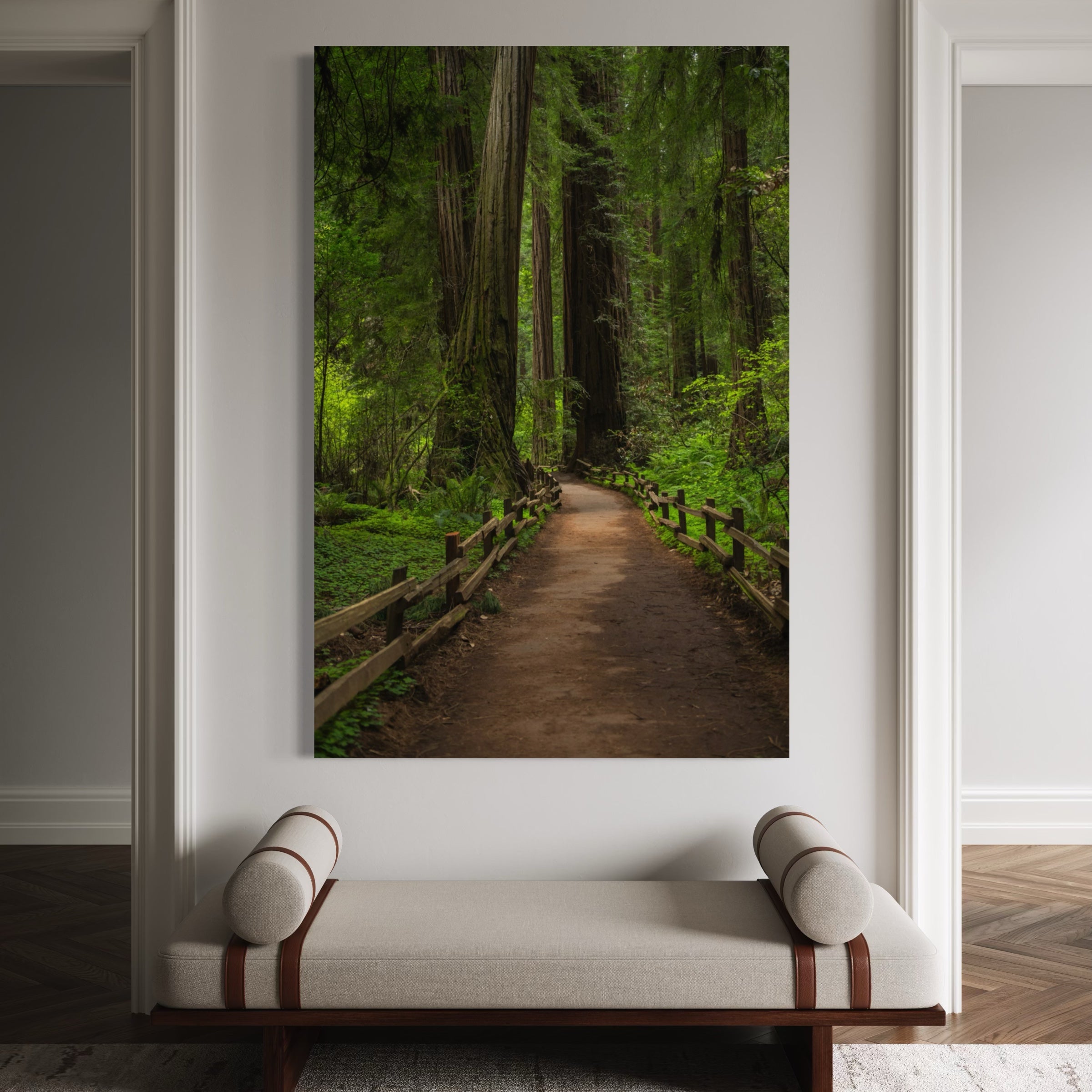 Cathedral of Giants metal print by Abigail Diane Photography displayed above a modern bench in an elegant entryway, featuring a tranquil redwood forest path in Muir Woods, California.