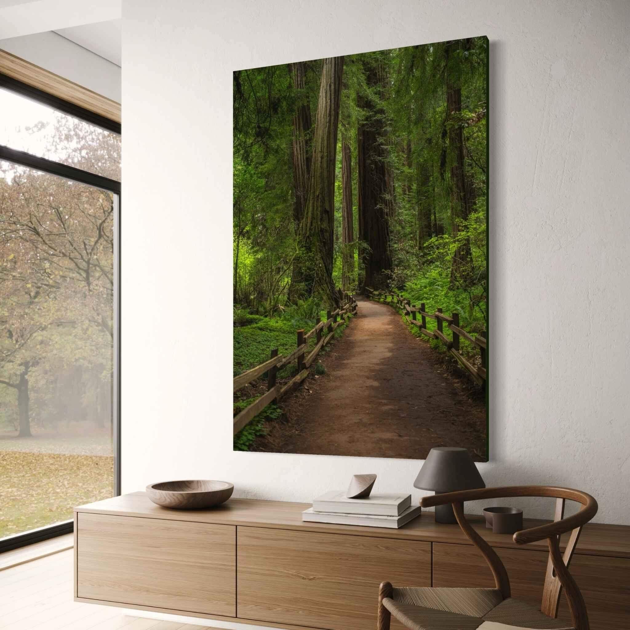 Large Cathedral of Giants canvas print featuring an ancient redwood forest pathway in Muir Woods California, displayed in a modern home with natural oak furniture and warm neutral décor. Fine art forest wall art and nature photography by Abigail Diane Photography.