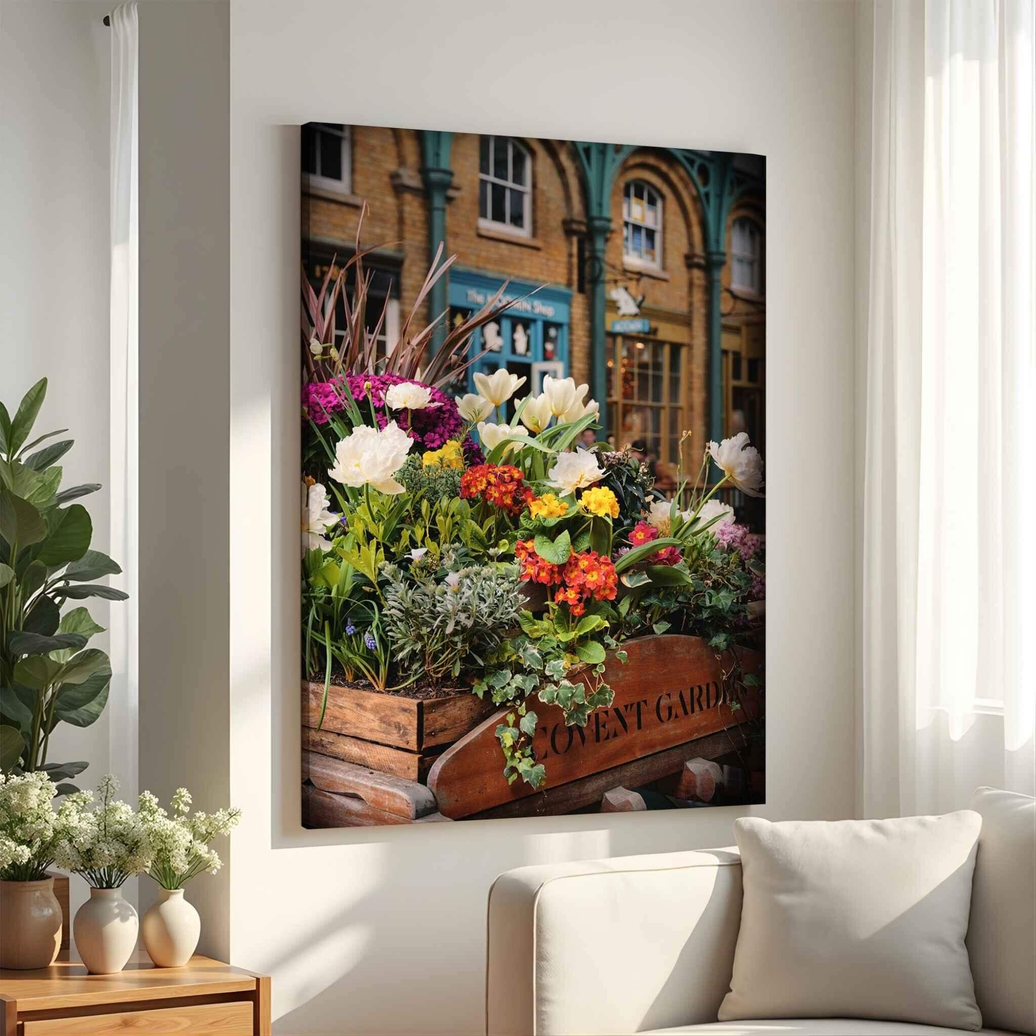 Large gallery-wrapped canvas print of Covent Garden in Bloom by Abigail Diane Photography displayed above a cream sofa in a bright modern living room with warm natural light.