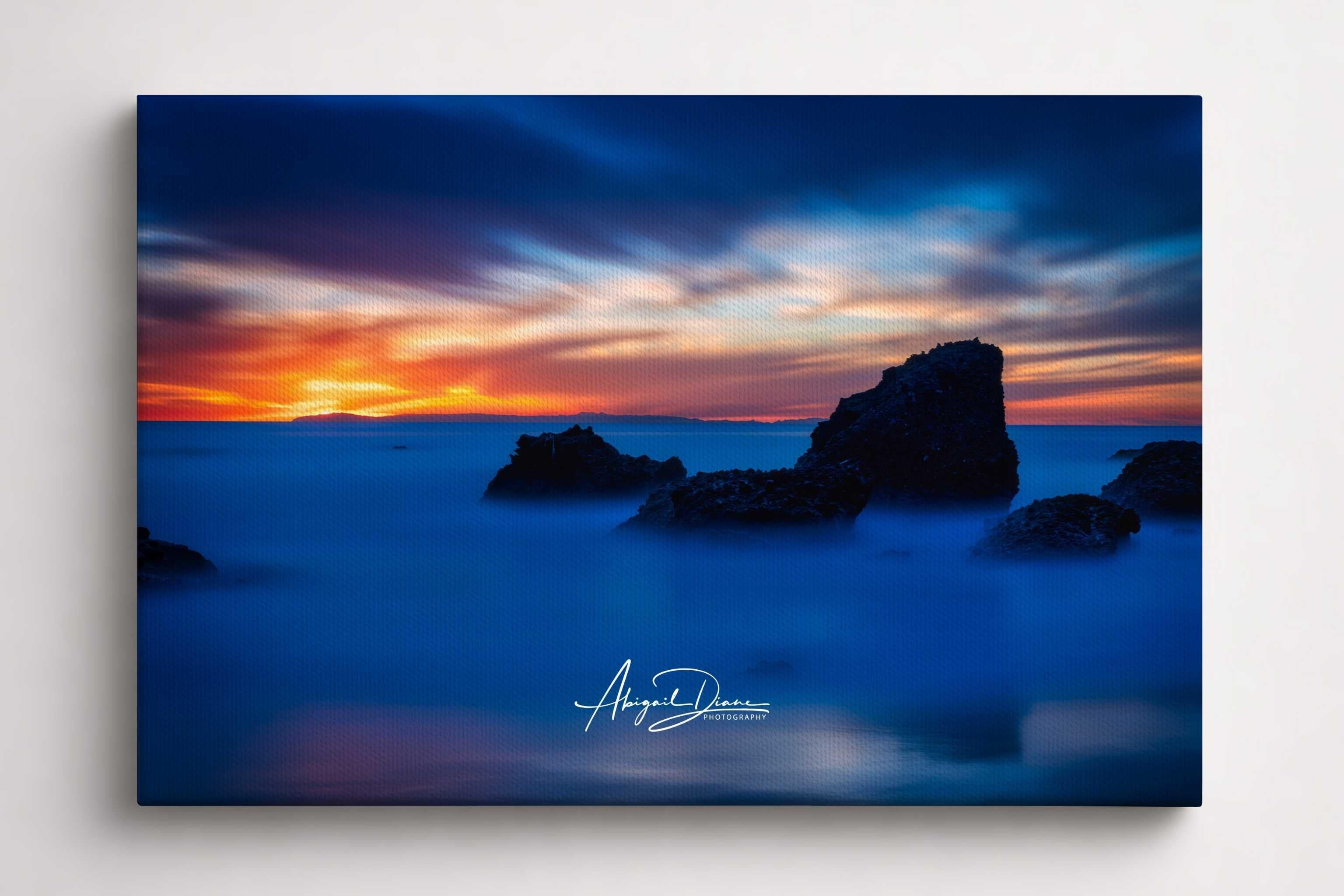 Escape to a Mystical Blue Hour features a long-exposure blue hour seascape with rugged coastal rock formations at Woods Cove, Laguna Beach, California. Fine art canvas print by Abigail Diane Photography.