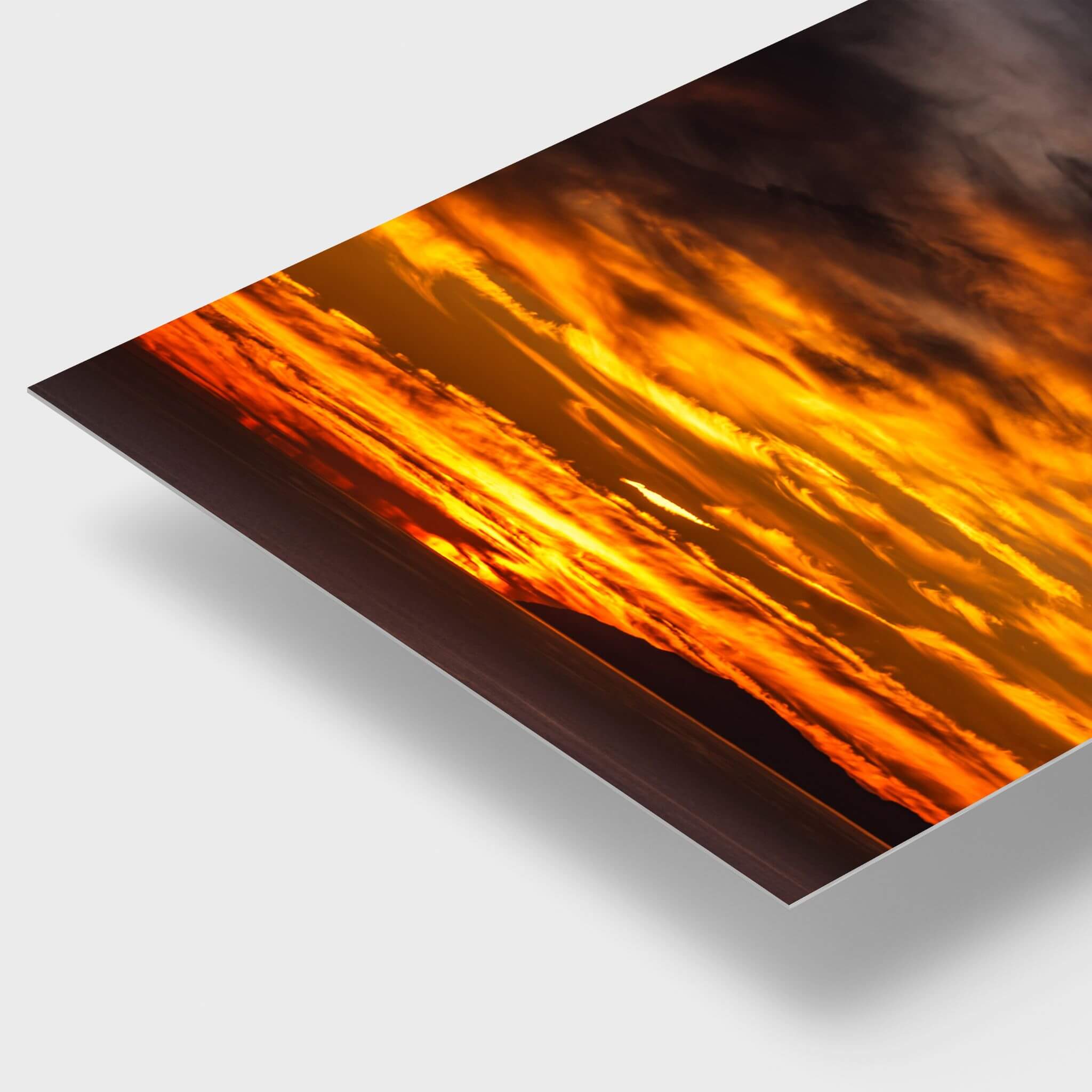 Close-up of Golden Gleaming Sunset HD metal print featuring dramatic golden clouds over the Pacific Ocean at Laguna Beach, California, with a vibrant glossy finish.