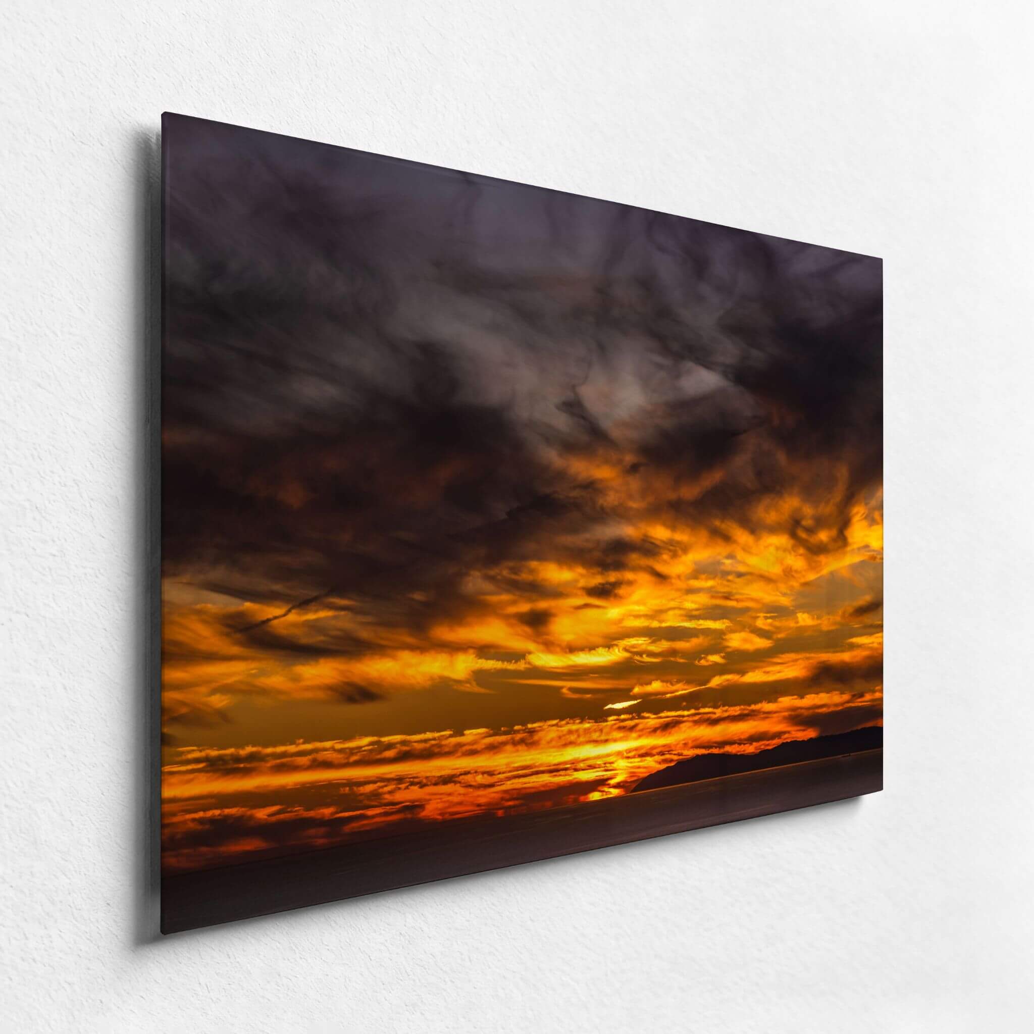 Angled view of Golden Gleaming Sunset HD metal print highlighting brilliant golden clouds, deep dramatic skies, and the contemporary edge of the metal artwork.