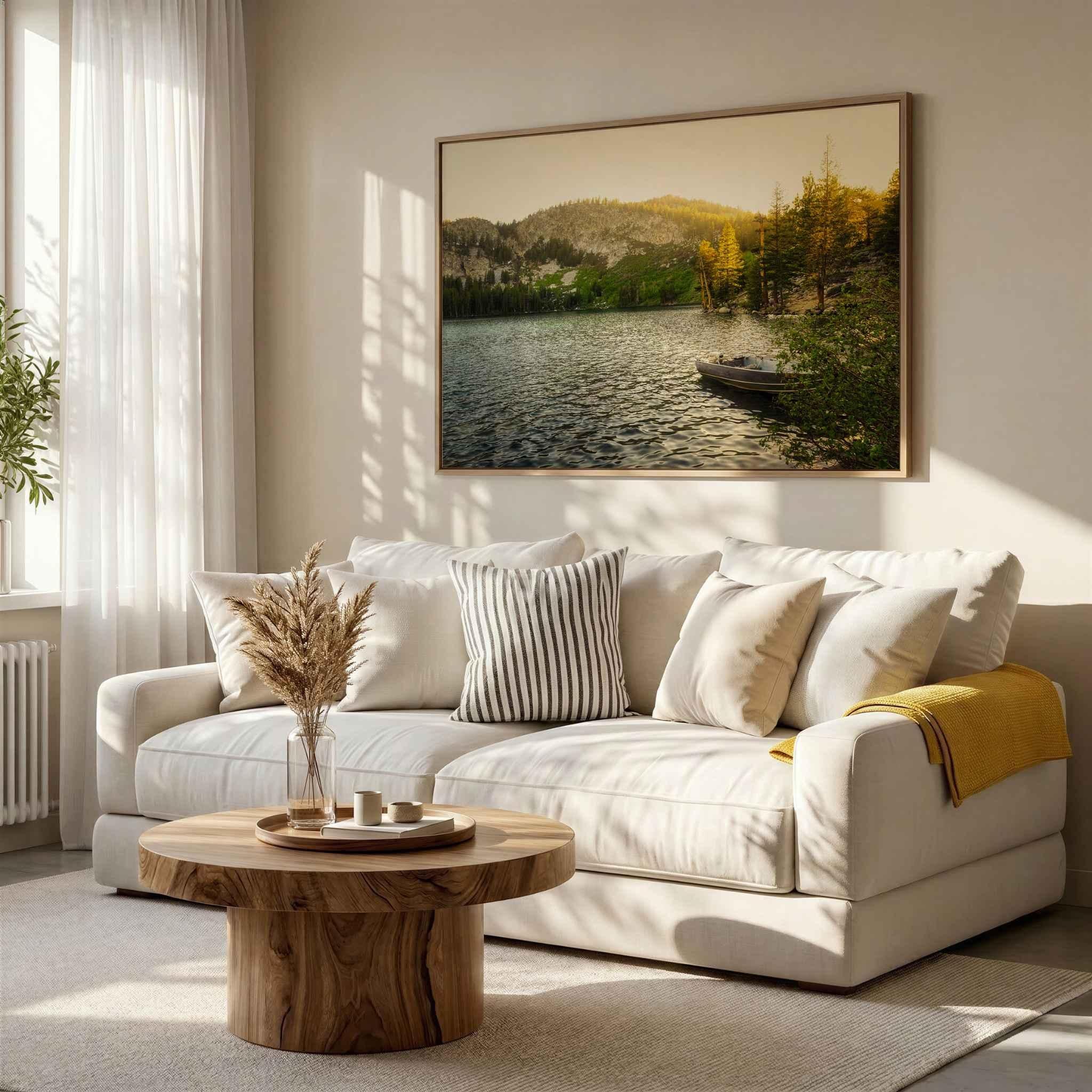 Golden Hour Alpine Lake at Lake George in California’s Eastern Sierra displayed as a natural wood framed fine art print above a cream sofa in a warm neutral living room.