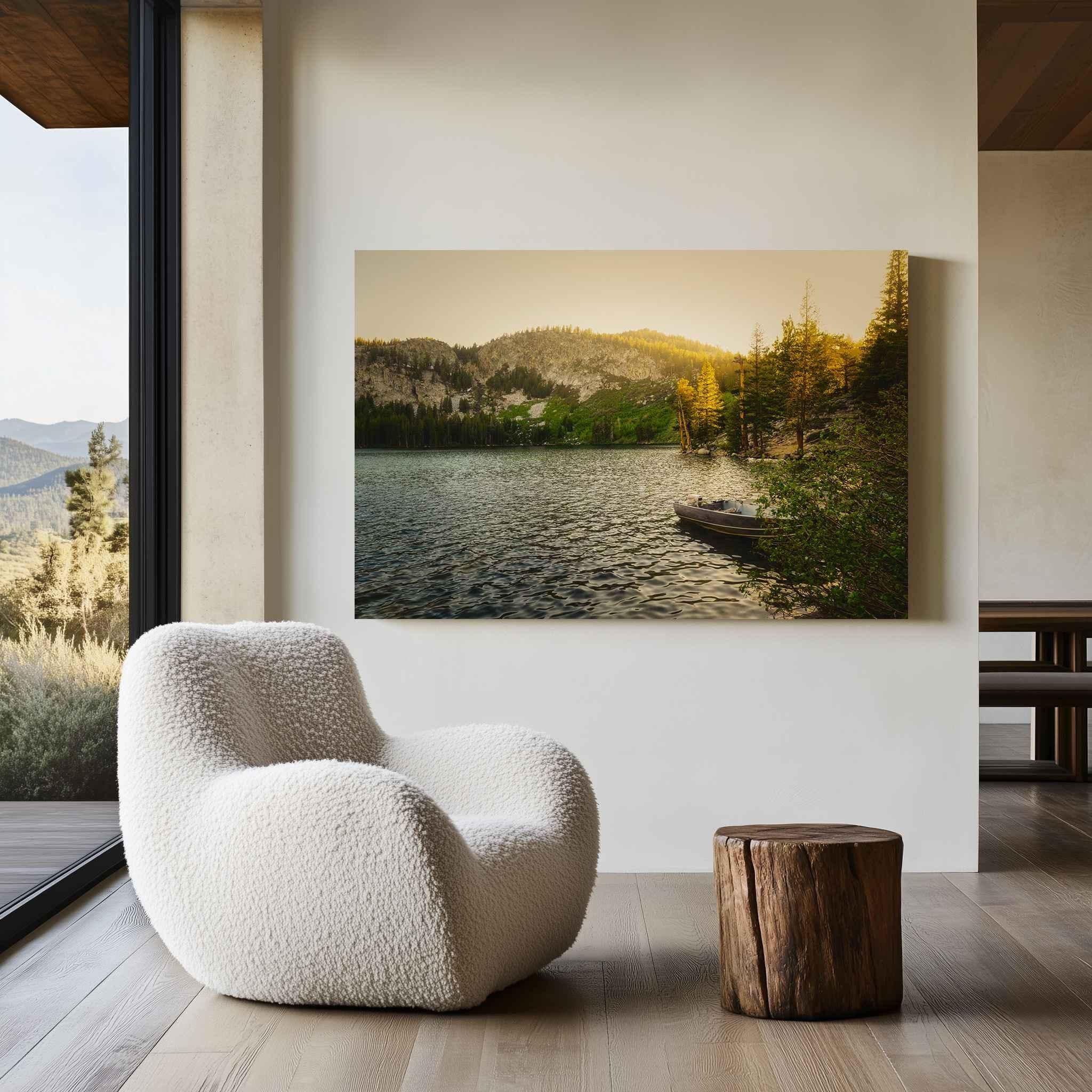 Golden Hour Alpine Lake metal print displayed in a modern mountain-inspired interior with a cream accent chair and natural wood furnishings.