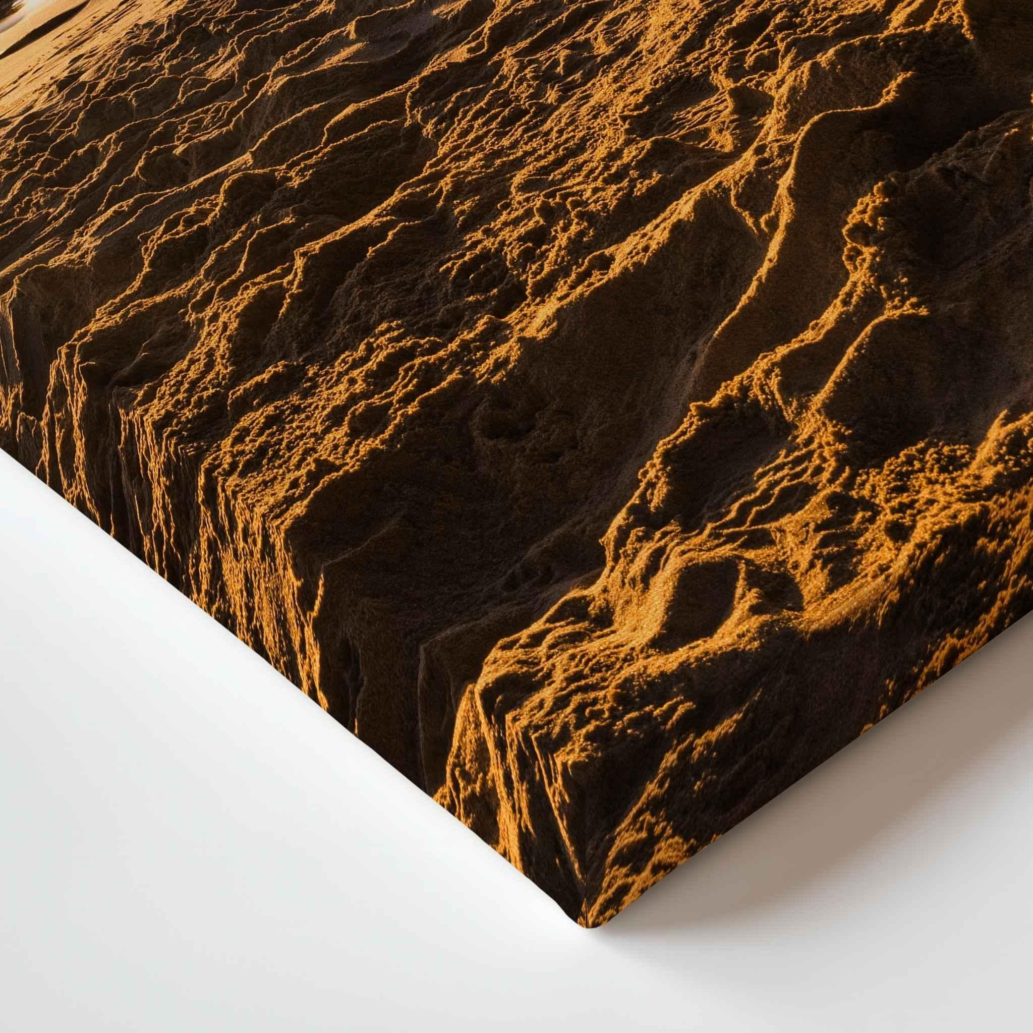 Close-up of Golden Hour Sunburst gallery-wrapped canvas corner featuring warm golden sunlight illuminating textured beach sand at sunset in Laguna Beach, California by Abigail Diane Photography.
