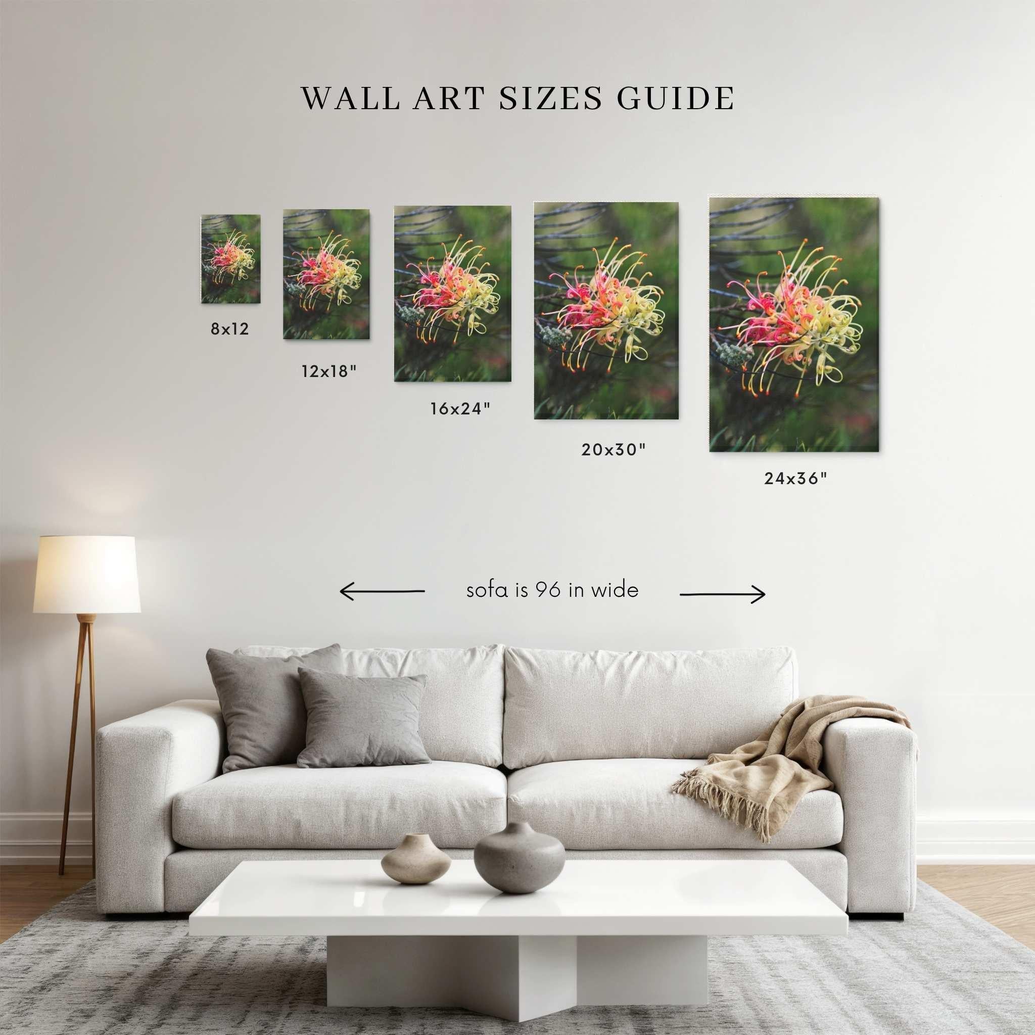 Wall art size guide showing gracefully-unfolding canvas print above a 96-inch sofa in 8x12, 12x18, 16x24, 20x30, 24x36  inch sizes to help visualize artwork scale in a living room.
